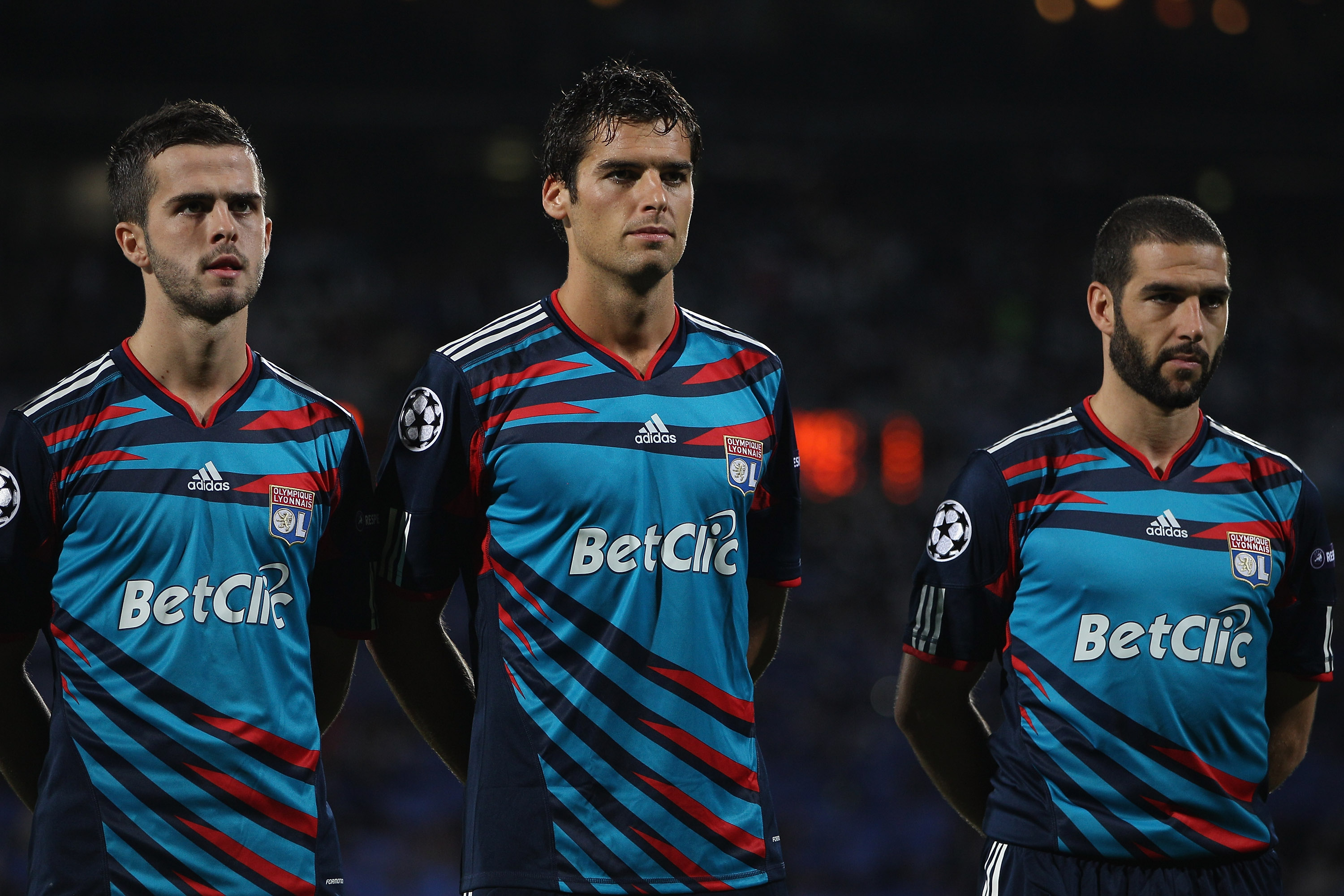 LYON, FRANCE - SEPTEMBER 14:  Miralem Pjanic (l),Yoann Gourcuff (c) and Lisandro (r) of Lyon line up before the UEFA Champions League Group B match between Olympique Lyonnais and FC Schalke 04 at the Stade de Gerland on September 14, 2010 in Lyon, France.