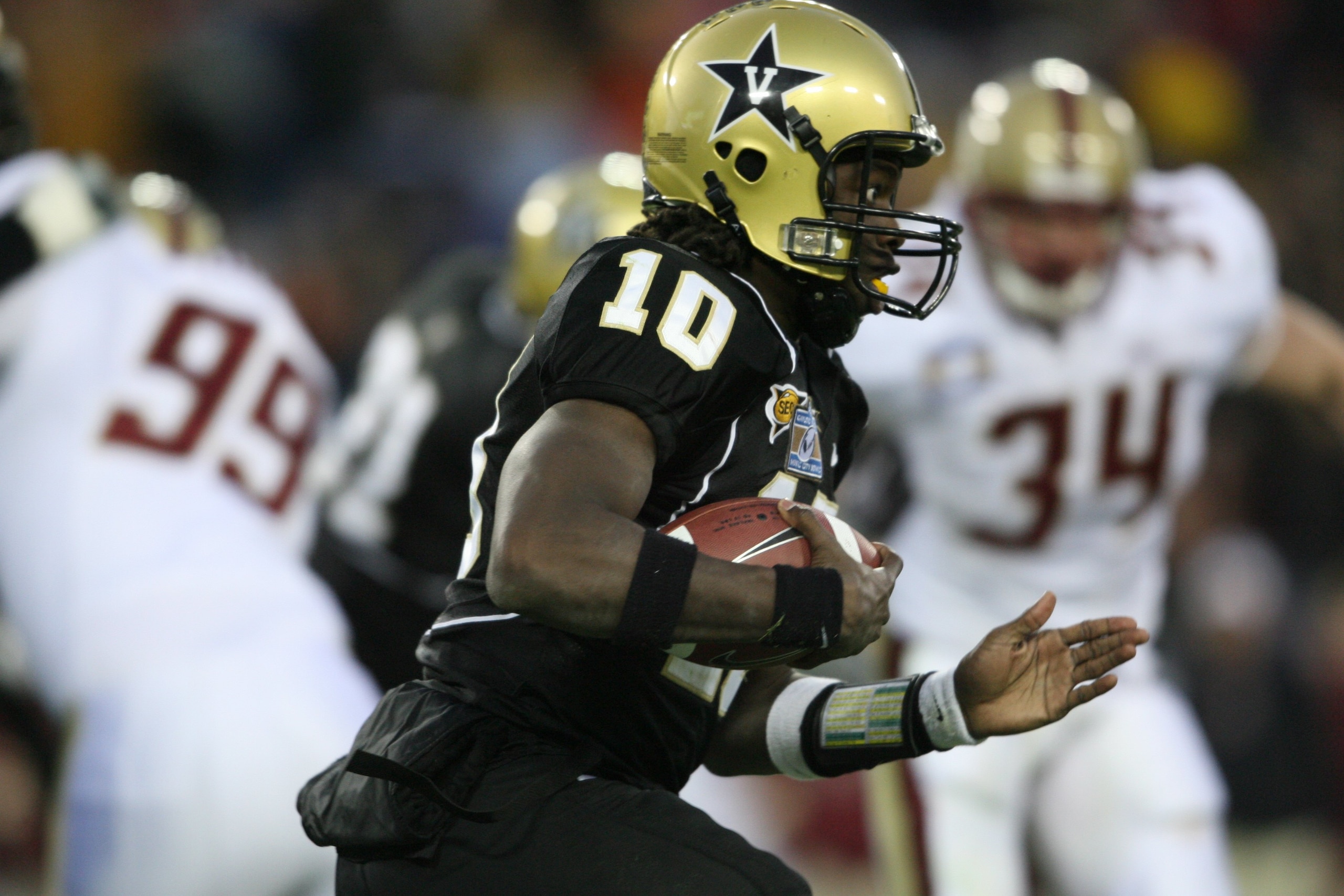 NASHVILLE, TN - DECEMBER 31:  Larry Smith #10 of the Vanderbilt Commodores carries the ball against the Boston College Eagles during the Gaylord Hotels Music City Bowl at LP Field on December 31, 2008 in Nashville, Tennessee.  (Photo by Andy Lyons/Getty I