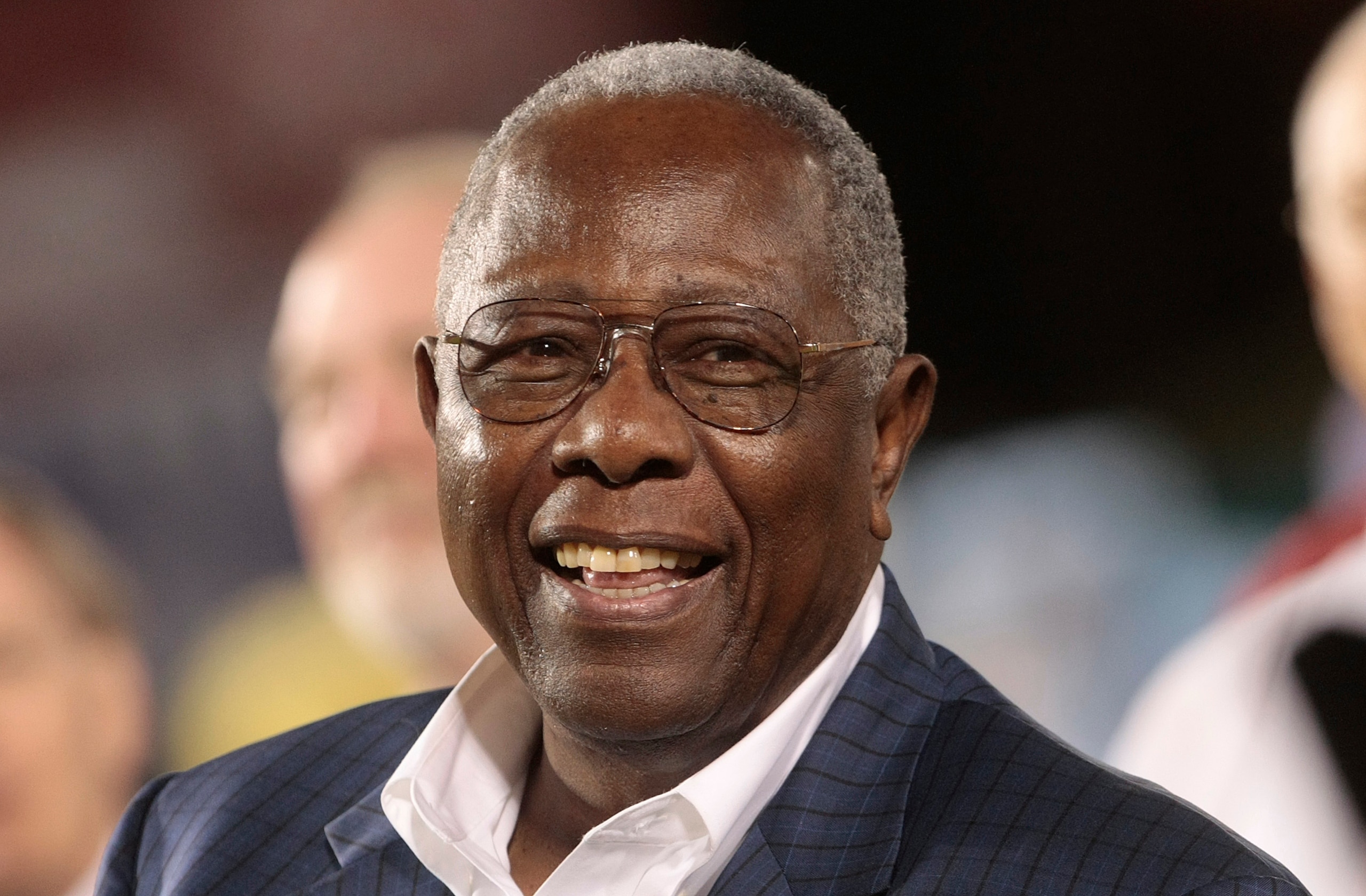 MOBILE, AL - APRIL 14:  Baseball Hall of Famer Hank Aaron listens during pre-game ceremonies following the opening of the Hank Aaron Museum at the Hank Aaron Stadium on April 14, 2010 in Mobile, Alabama.  (Photo by Dave Martin/Getty Images)
