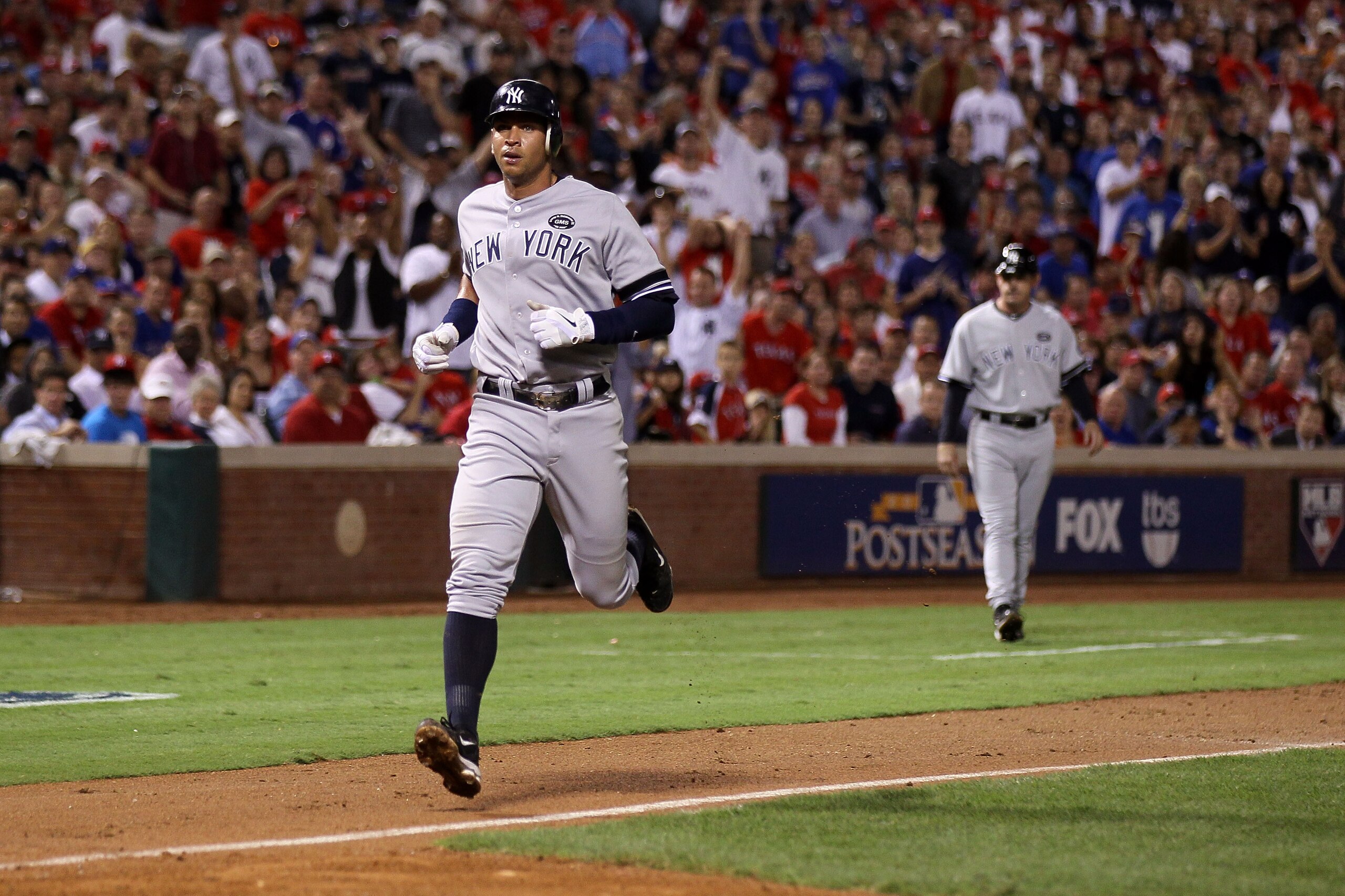 ARLINGTON, TX - OCTOBER 22:  Alex Rodriguez #13 of the New York Yankees runs home on a wild pitch from Colby Lewis #48 of the Texas Rangers in Game Six of the ALCS during the 2010 MLB Playoffs at Rangers Ballpark in Arlington on October 22, 2010 in Arling