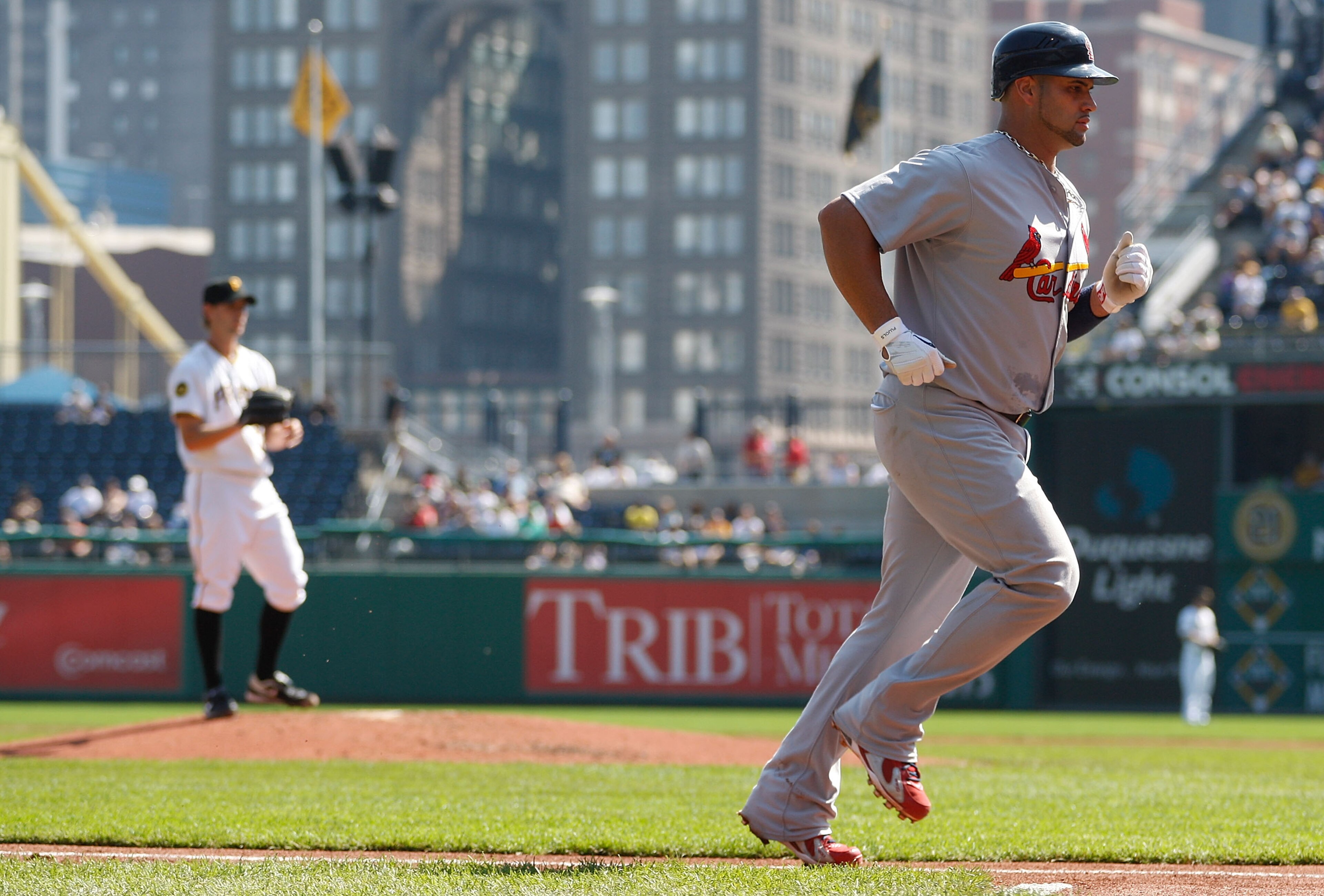 PITTSBURGH - SEPTEMBER 23: Albert Pujols #5 of the St Louis Cardinals jogs to home plate after hitting a two run home run off of Brian Burres #71 the Pittsburgh Pirates during the game on September 23, 2010 at PNC Park in Pittsburgh, Pennsylvania. (Phot PITTSBURGH - SEPTEMBER 23: Albert Pujols #5 of the St Louis Cardinals jogs to home plate after hitting a two run home run off of Brian Burres #71 the Pittsburgh Pirates during the game on September 23, 2010 at PNC Park in Pittsburgh, Pennsylvania. (Phot