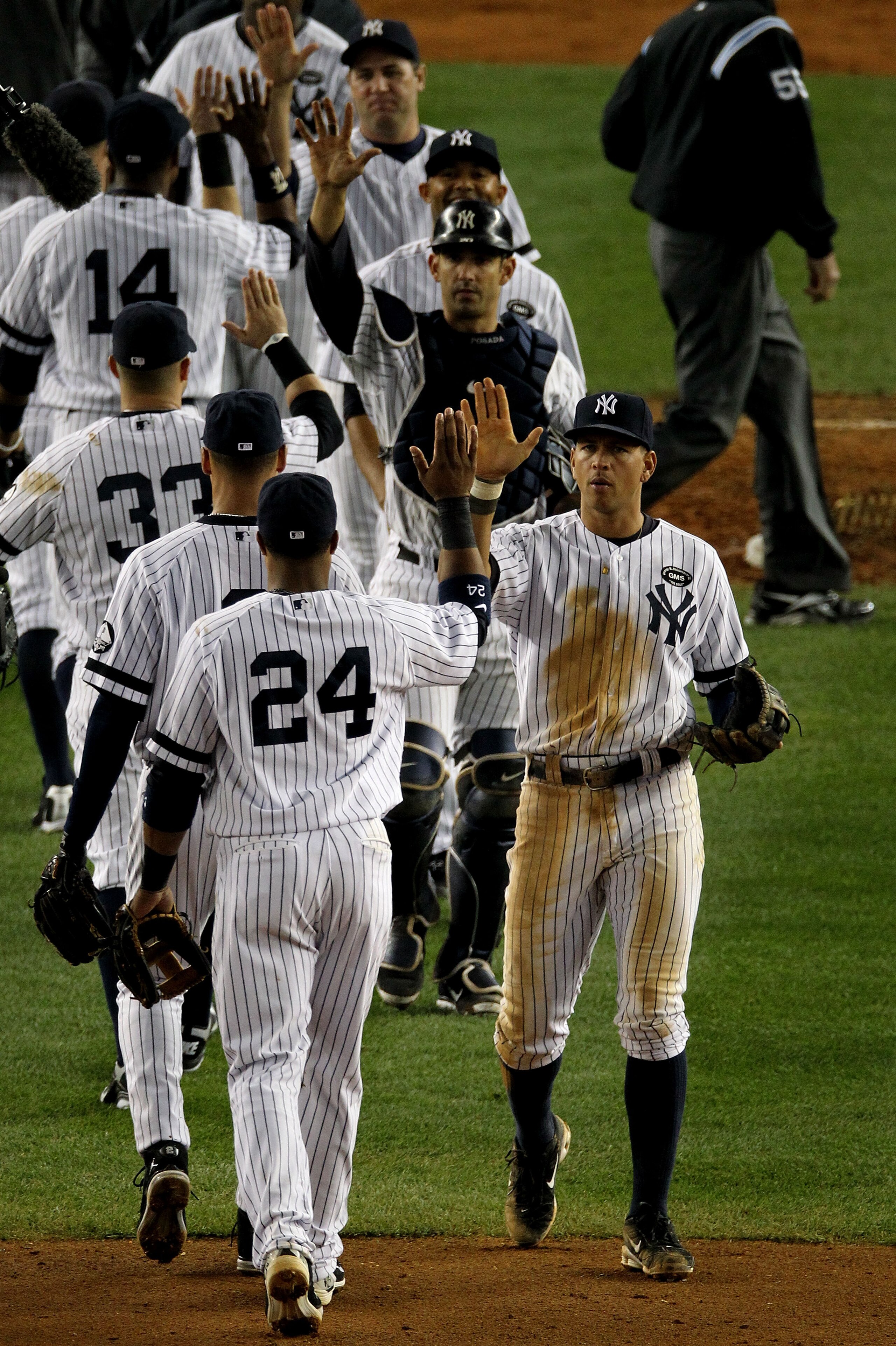 NEW YORK - OCTOBER 20:  Alex Rodriguez #13 and Robinson Cano #24 of the New York Yankees celebrate after the Yankees won 7-2 against the Texas Rangers in Game Five of the ALCS during the 2010 MLB Playoffs at Yankee Stadium on October 20, 2010 in the Bronx
