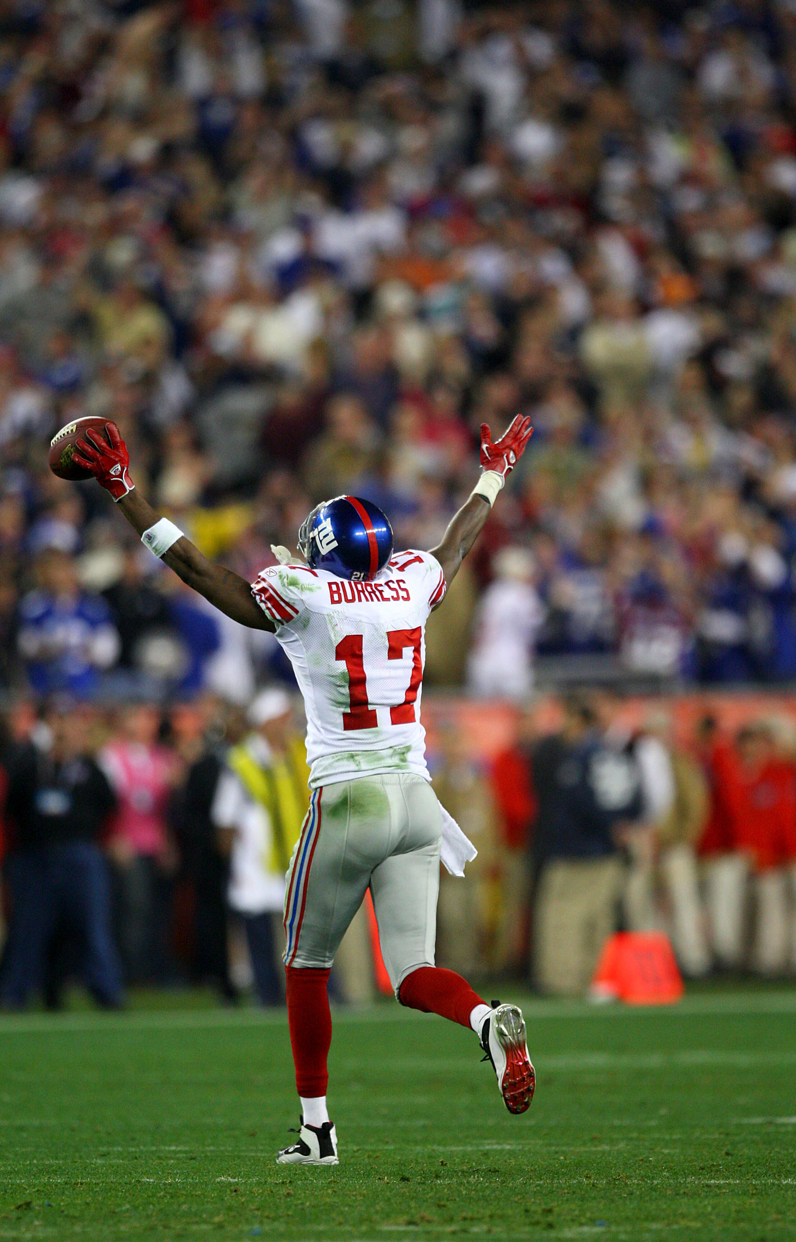 GLENDALE, AZ - FEBRUARY 03:  Wide receiver Plaxico Burress #17 of the New York Giants celebrates after catching a 13-yard touchdown pass in the fourth quarter against the New England Patriots during Super Bowl XLII on February 3, 2008 at the University of