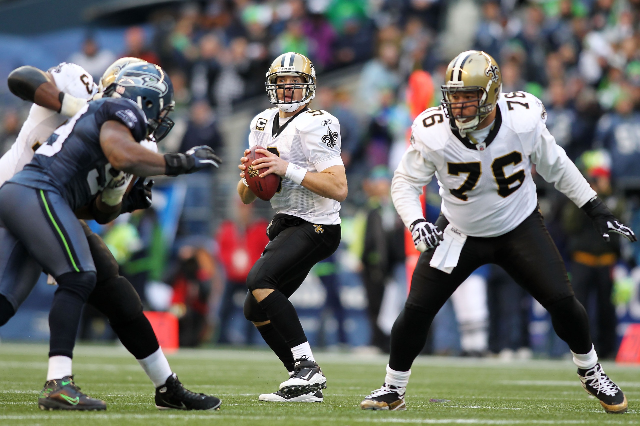SEATTLE, WA - JANUARY 08:  Drew Brees #9 of the New Orleans Saints scrambles against the Seattle Seahawks during the 2011 NFC wild-card playoff game at Qwest Field on January 8, 2011 in Seattle, Washington.  (Photo by Jonathan Ferrey/Getty Images)