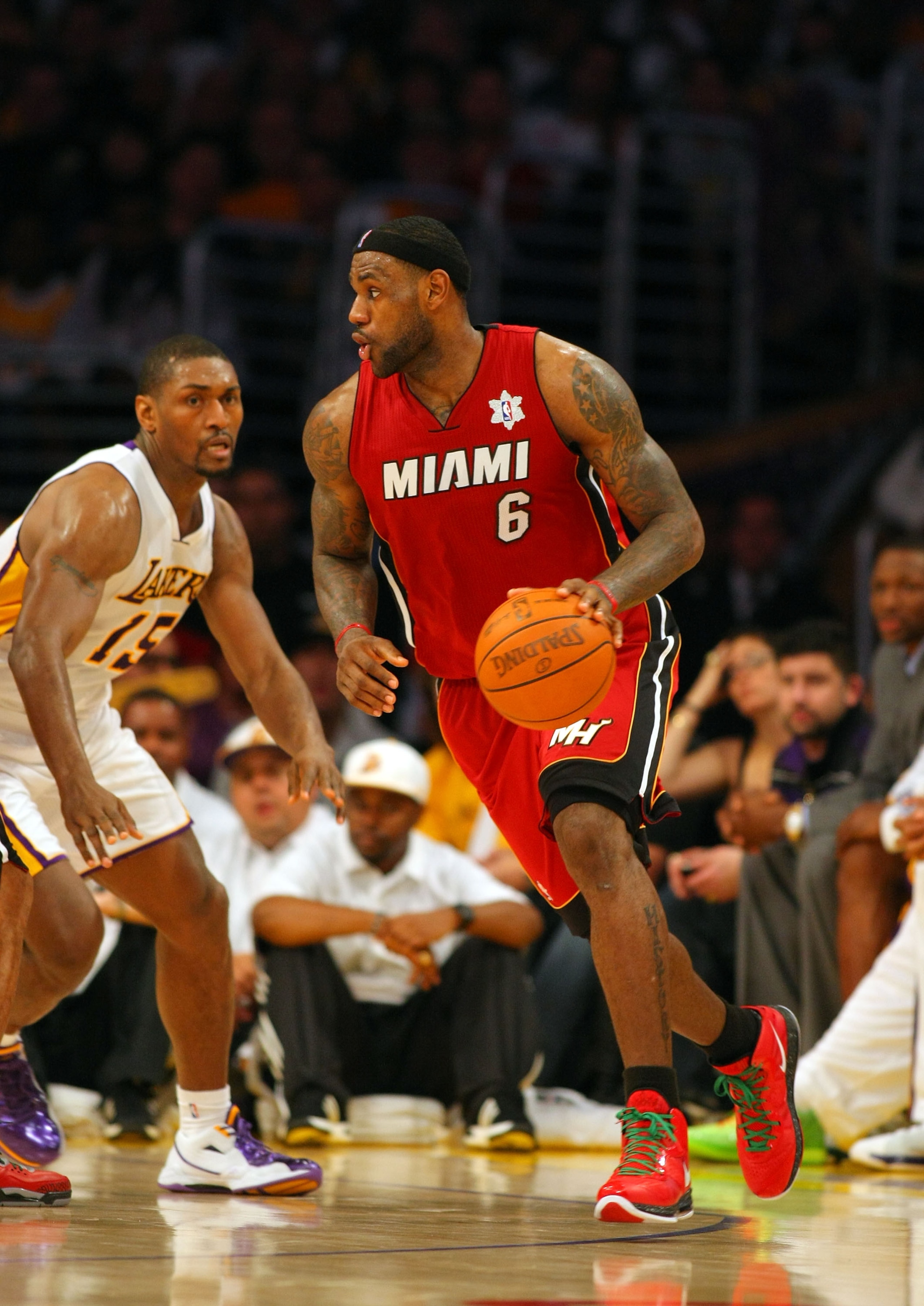 LOS ANGELES, CA - DECEMBER 25: LeBron James #6 of the Miami Heat dribbles the ball along the perimeter against Ron Artest #15 of the Los Angeles Lakers during the NBA game at Staples Center on December 25, 2010 in Los Angeles, California. The Heat defeat LOS ANGELES, CA - DECEMBER 25: LeBron James #6 of the Miami Heat dribbles the ball along the perimeter against Ron Artest #15 of the Los Angeles Lakers during the NBA game at Staples Center on December 25, 2010 in Los Angeles, California. The Heat defeat