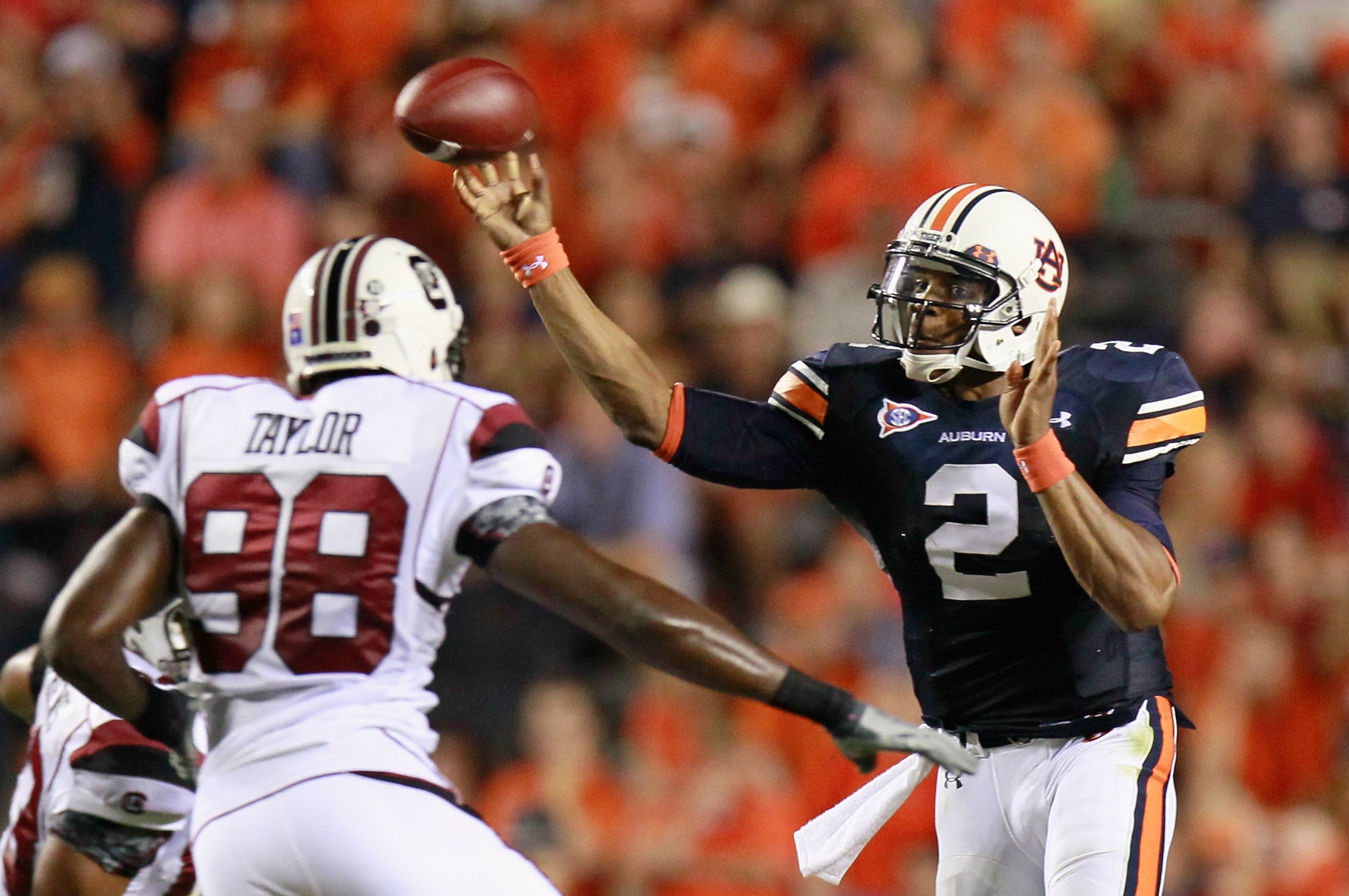 AUBURN, AL - SEPTEMBER 25: Quarterback Cameron Newton #2 of the Auburn Tigers passes the ball in front of Devin Taylor #98 of the South Carolina Gamecocks at Jordan-Hare Stadium on September 25, 2010 in Auburn, Alabama. (Photo by Kevin C. Cox/Getty Imag AUBURN, AL - SEPTEMBER 25: Quarterback Cameron Newton #2 of the Auburn Tigers passes the ball in front of Devin Taylor #98 of the South Carolina Gamecocks at Jordan-Hare Stadium on September 25, 2010 in Auburn, Alabama. (Photo by Kevin C. Cox/Getty Imag