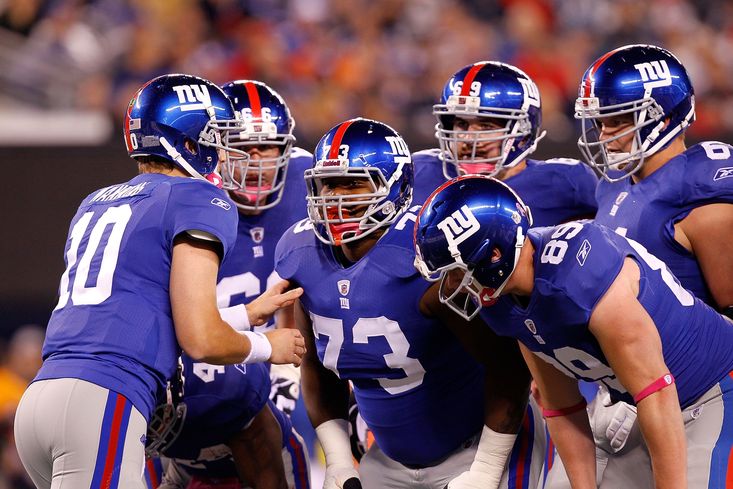 EAST RUTHERFORD, NJ - OCTOBER 03: Eli Manning #10 of the New York Giants talks to David Diehl #66, Shawn Andrews #73, Rich Seubert #69, Adam Koets #61 and Kevin Boss #89 in the huddle against the Chicago Bears at New Meadowlands Stadium on October 3, 201 EAST RUTHERFORD, NJ - OCTOBER 03: Eli Manning #10 of the New York Giants talks to David Diehl #66, Shawn Andrews #73, Rich Seubert #69, Adam Koets #61 and Kevin Boss #89 in the huddle against the Chicago Bears at New Meadowlands Stadium on October 3, 201