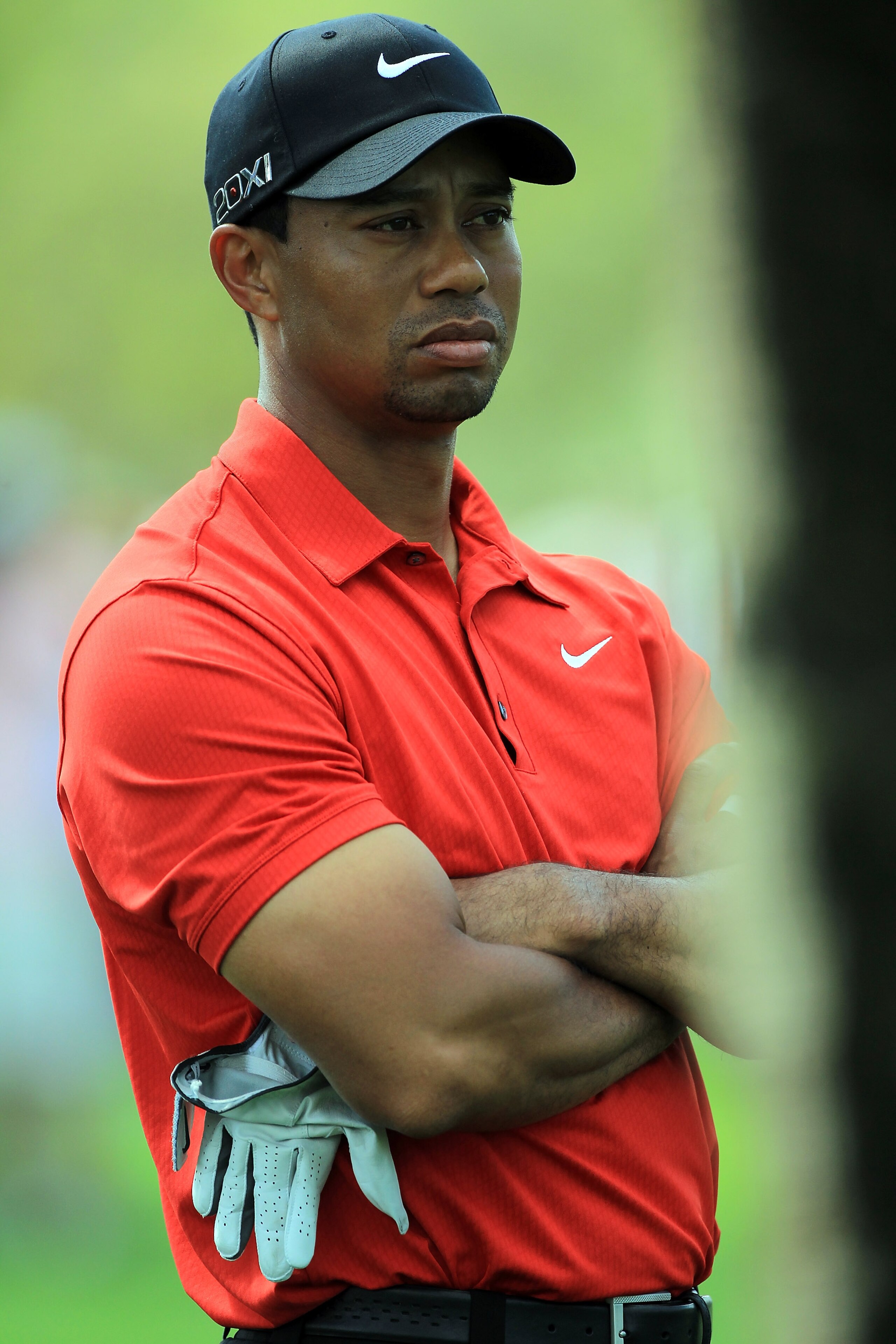 DUBAI, UNITED ARAB EMIRATES - FEBRUARY 13:  Tiger Woods of the USA waits to play his second shot at the par 4, 1st hole during the final round of the 2011 Omega Dubai Desert Classic on the Majilis Course at the Emirates Golf Club on February 13, 2011 in D