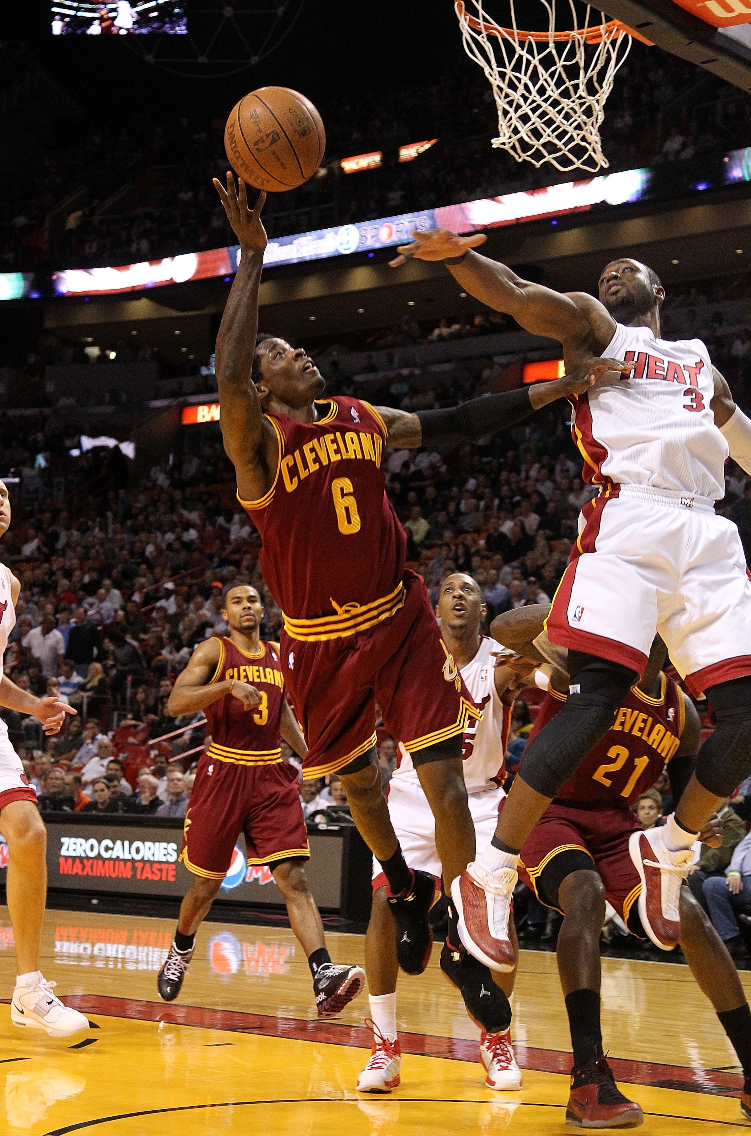 MIAMI, FL - JANUARY 31:  Manny Harris #6 of the  Cleveland Cavaliers shoots over Dwyane Wade #3 of the Miami Heat during a game against at American Airlines Arena on January 31, 2011 in Miami, Florida. NOTE TO USER: User expressly acknowledges and agrees