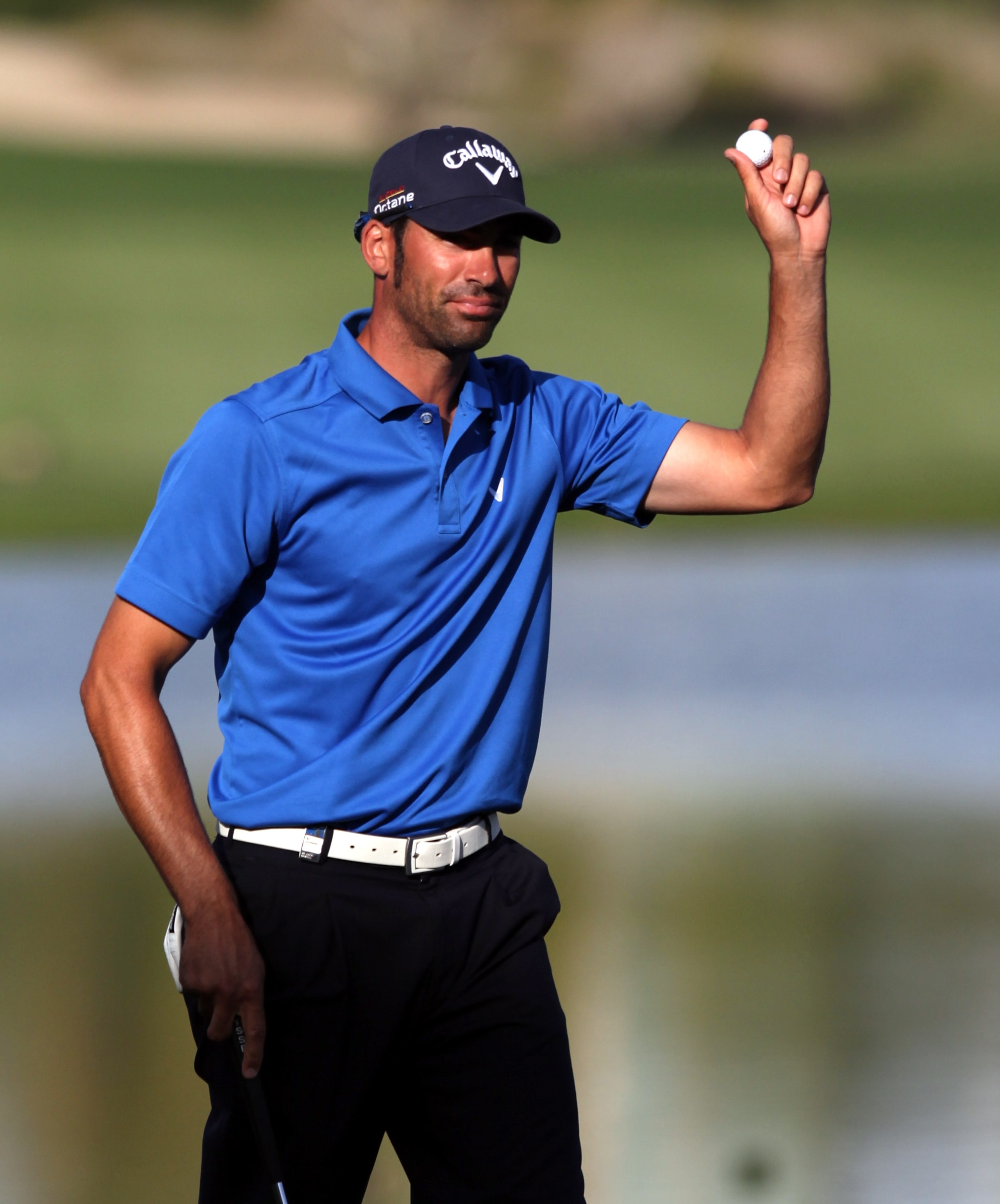 DUBAI, UNITED ARAB EMIRATES - FEBRUARY 13:  Alvaro Quiros of Spain celebrates after the final round of the Omega Dubai Desert Classic on the Majlis course at the Emirates Golf Club on February 13, 2011 in Dubai, United Arab Emirates.  (Photo by Ross Kinna