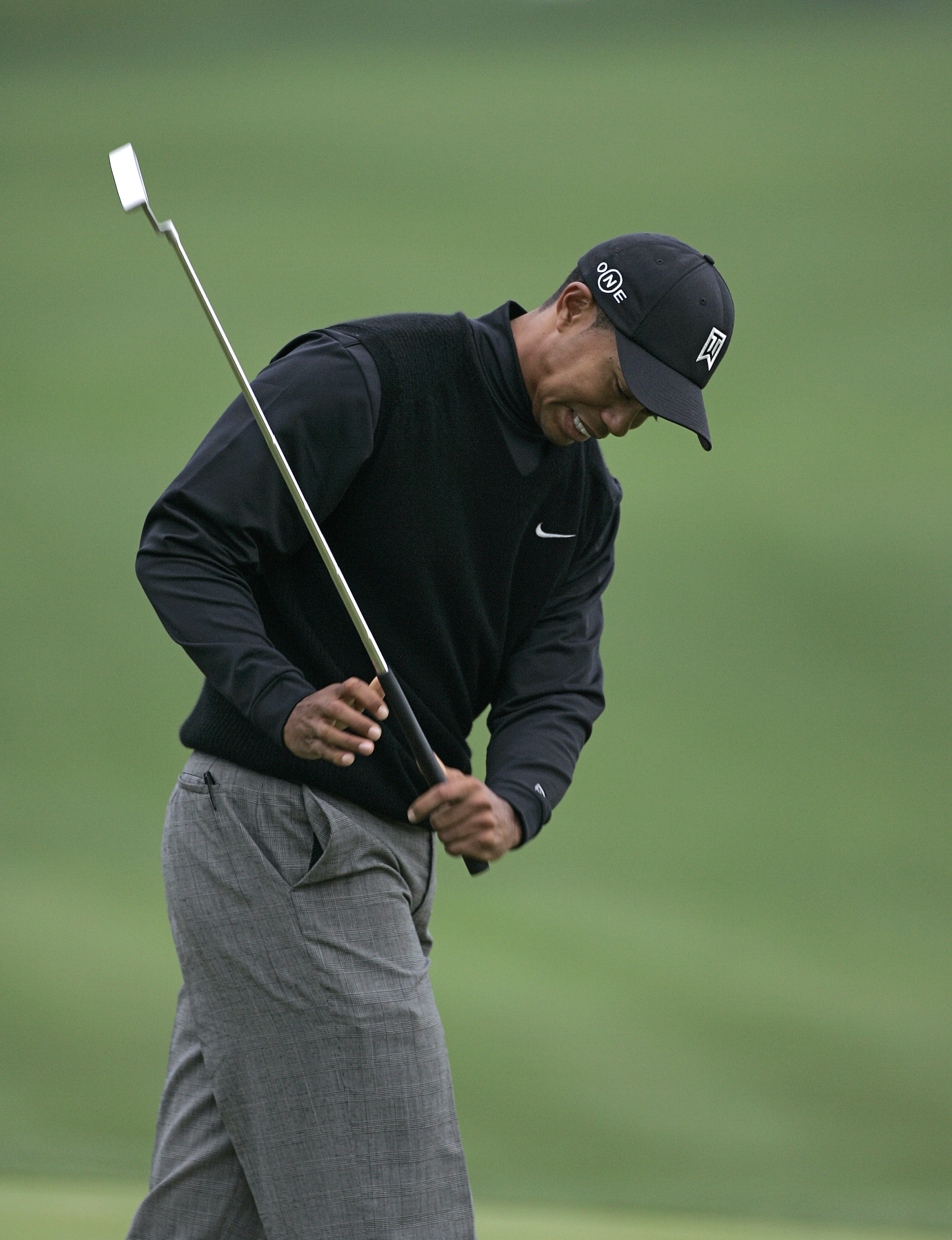 UNITED STATES - MARCH 23:  Tiger Woods reacts to a missed putt on the 18th green during the first round for THE PLAYERS Championship held at the TPC Stadium Course in Ponte Vedra Beach, Florida on March 23, 2006.  (Photo by Michael Cohen/Getty Images)