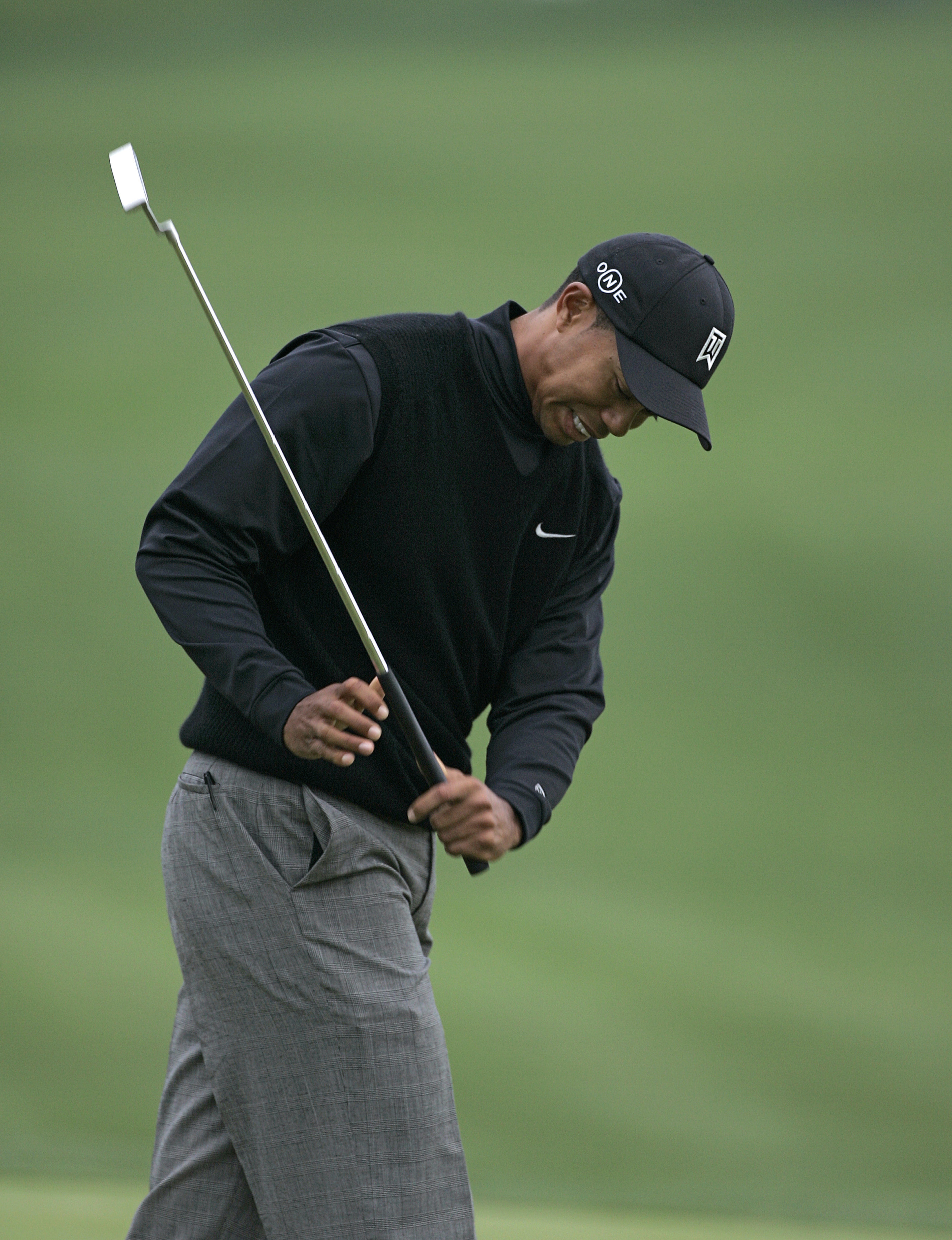 UNITED STATES - MARCH 23:  Tiger Woods reacts to a missed putt on the 18th green during the first round for THE PLAYERS Championship held at the TPC Stadium Course in Ponte Vedra Beach, Florida on March 23, 2006.  (Photo by Michael Cohen/Getty Images)