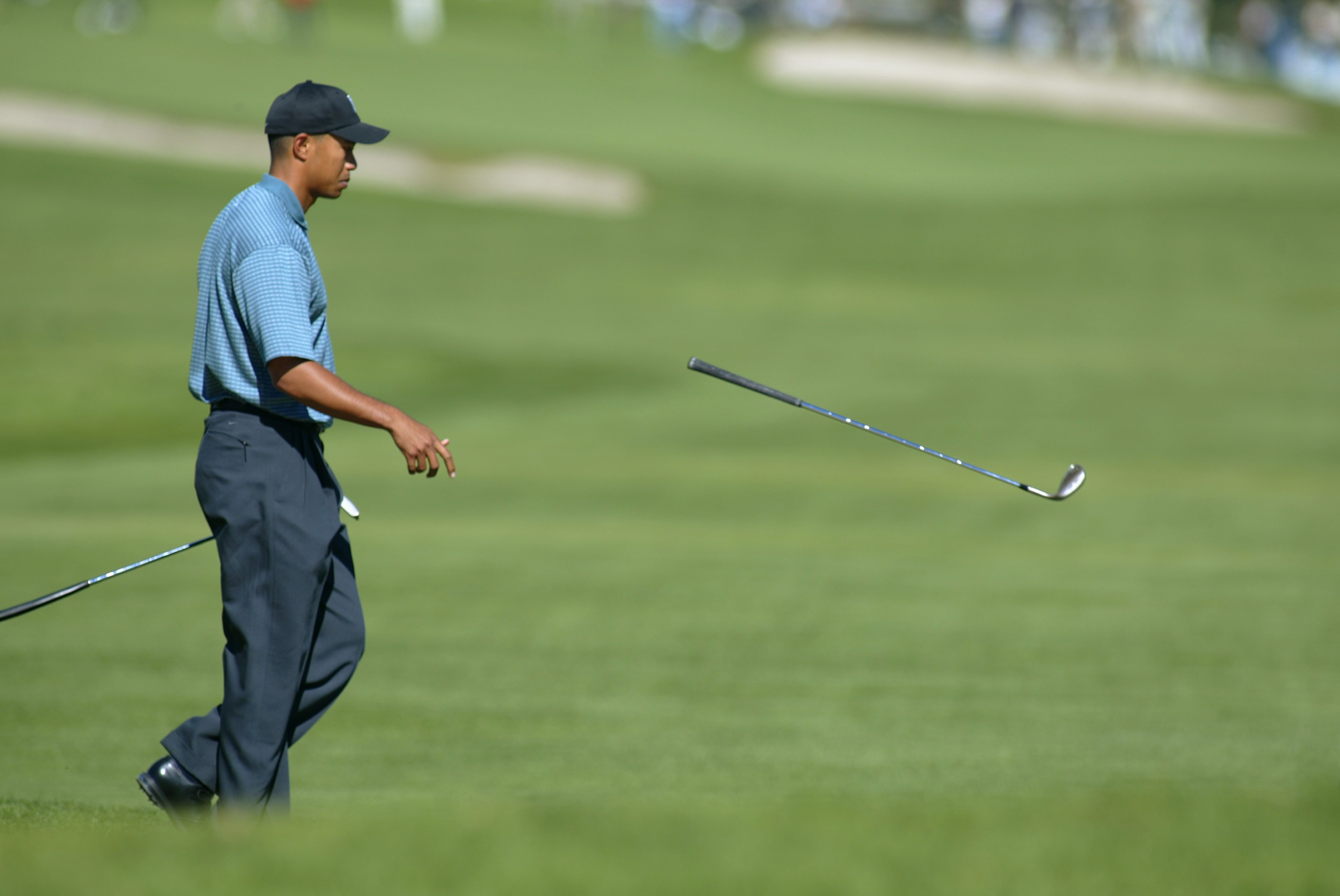 PACIFIC PALISADES, CA - FEBRUARY 20:  Tiger Woods tosses his club after a shot during the first round of the Nissan Open on February 20, 2003 at Riveria C.C. in Pacific Palisades, California.  (Photo by Scott Halleran/Getty Images)
