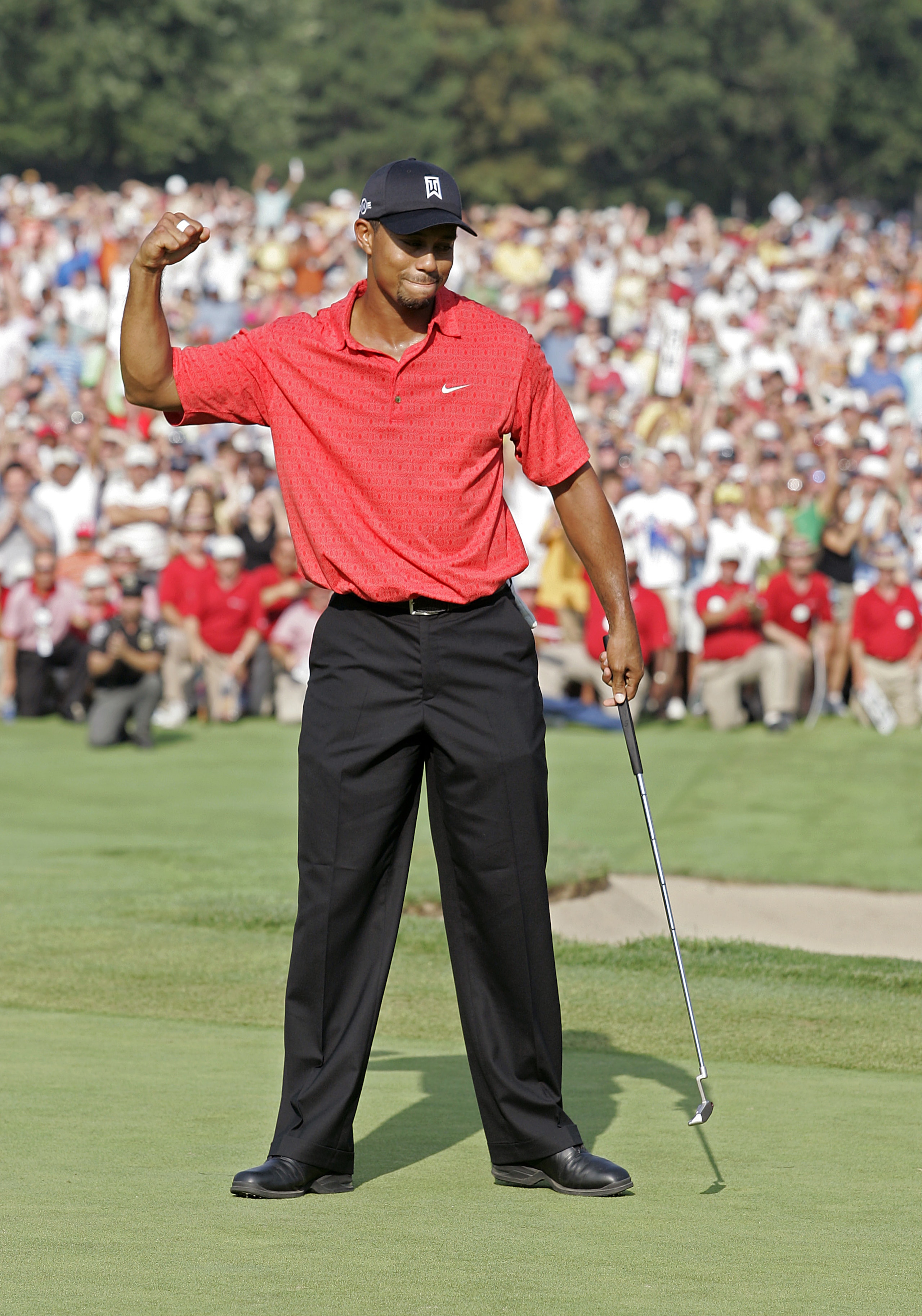 UNITED STATES - AUGUST 06:  Tiger Woods wins his 50th PGA TOUR event during the fourth and final round of the Buick Open at Warwick Hills Golf and Country Club in Grand Blanc, Michigan on August 6, 2006.  (Photo by Michael Cohen/Getty Images)
