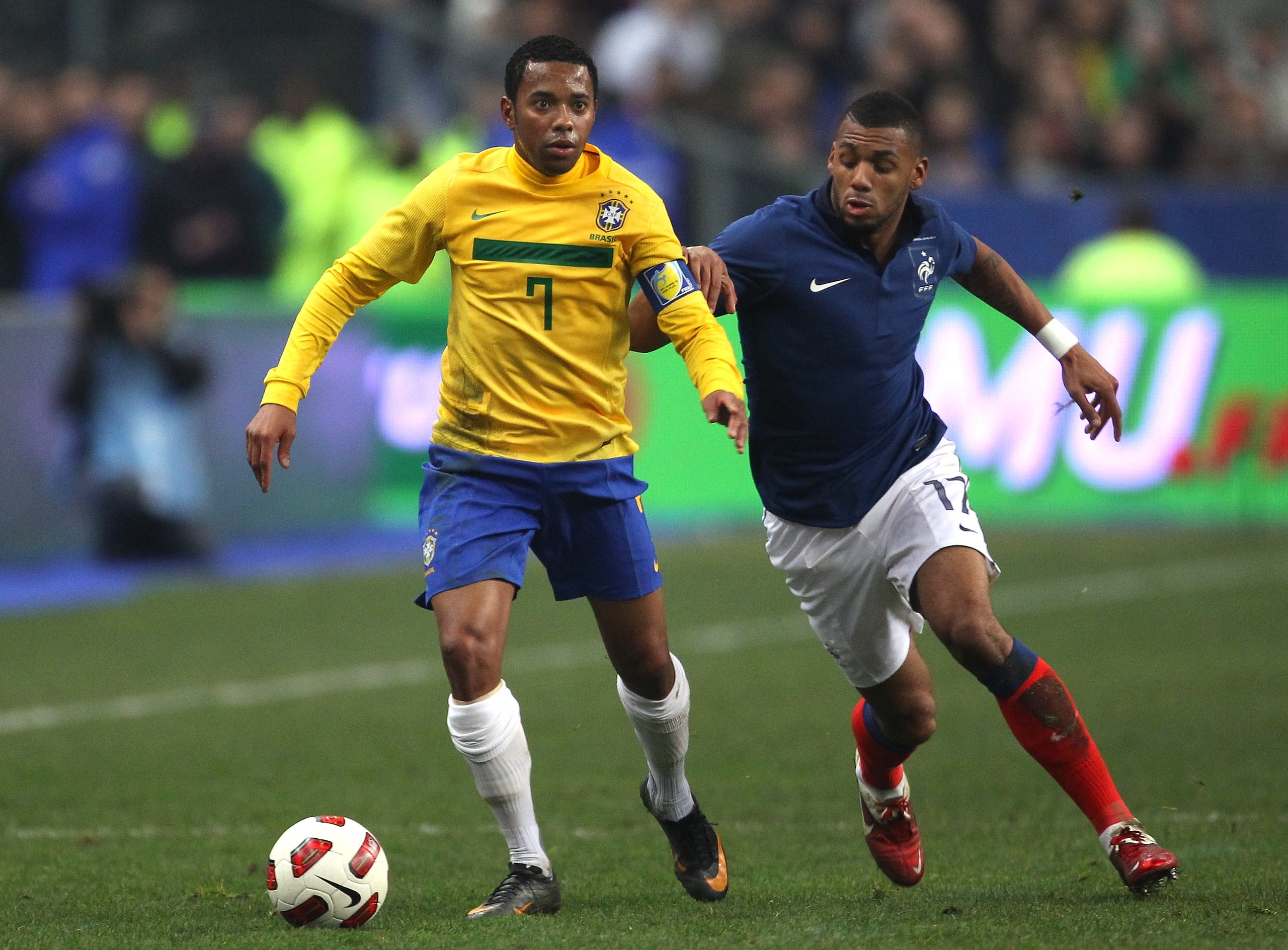 PARIS, FRANCE - FEBRUARY 09: Robinho of Brazil holds off a challenge from Yann M'Vila of France during the International friendly match between France and Brazil at Stade de France on February 9, 2011 in Paris, France. (Photo by Alex Livesey/Getty Image PARIS, FRANCE - FEBRUARY 09: Robinho of Brazil holds off a challenge from Yann M'Vila of France during the International friendly match between France and Brazil at Stade de France on February 9, 2011 in Paris, France. (Photo by Alex Livesey/Getty Image