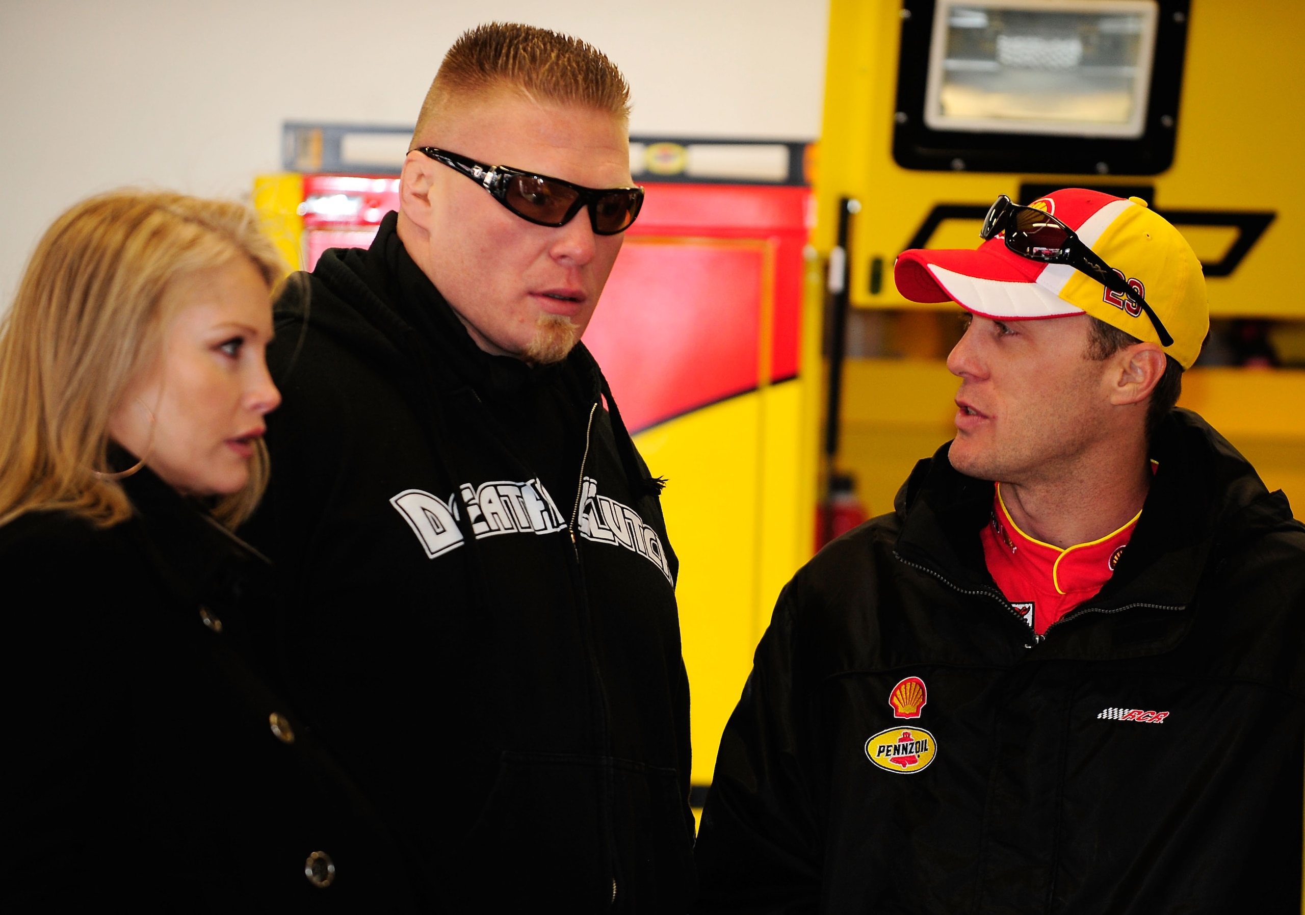 DAYTONA BEACH, FL - FEBRUARY 13: MMA fighter Brock Lesnar(C) speaks with Kevin Harvick(R), driver of the #29 Shell/Pennzoil Chevrolet, during practice for the Daytona 500 at Daytona International Speedway on February 13, 2010 in Daytona Beach, Florida. DAYTONA BEACH, FL - FEBRUARY 13: MMA fighter Brock Lesnar(C) speaks with Kevin Harvick(R), driver of the #29 Shell/Pennzoil Chevrolet, during practice for the Daytona 500 at Daytona International Speedway on February 13, 2010 in Daytona Beach, Florida.