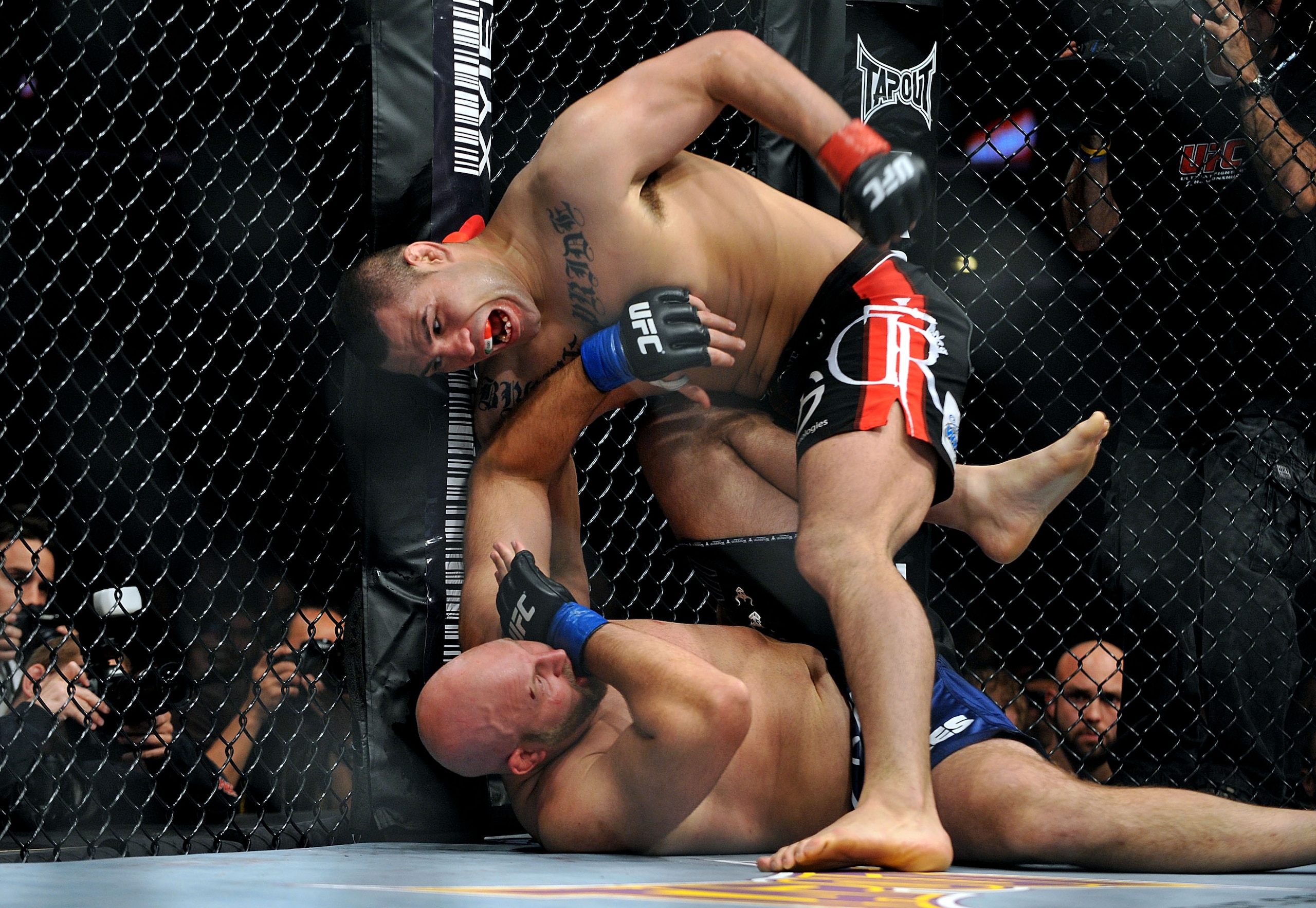 LOS ANGELES, CA - OCTOBER 24: UFC fighter Cain Velasquez (top) battles with UFC fighter Ben Rothwell (bottom) during their Heavyweight bout at UFC 104: Machida vs. Shogun at Staples Center on October 24, 2009 in Los Angeles, California. (Photo by Jon Ko LOS ANGELES, CA - OCTOBER 24: UFC fighter Cain Velasquez (top) battles with UFC fighter Ben Rothwell (bottom) during their Heavyweight bout at UFC 104: Machida vs. Shogun at Staples Center on October 24, 2009 in Los Angeles, California. (Photo by Jon Ko