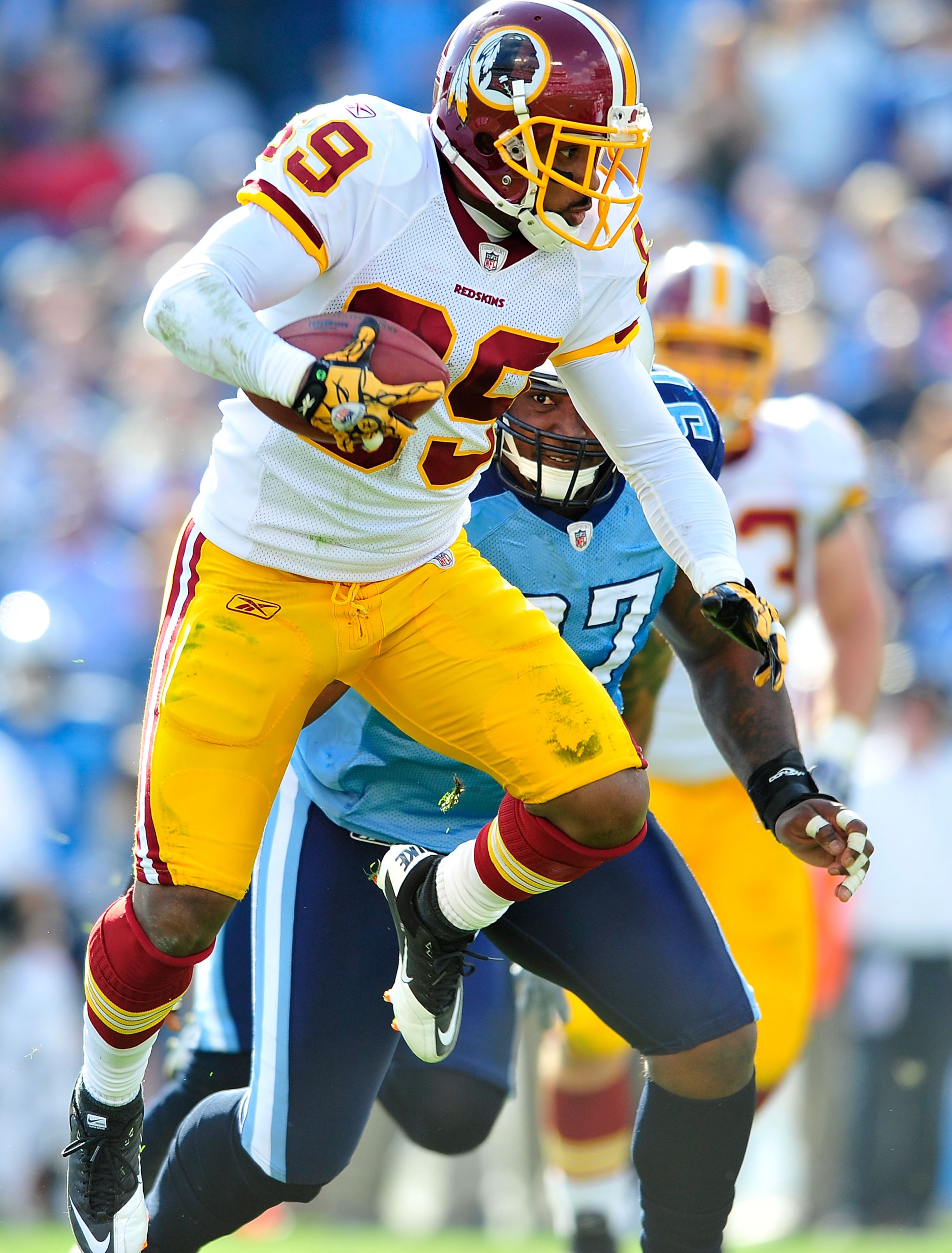 NASHVILLE, TN - NOVEMBER 21:  Santana Moss #89 of the Washington Redskins makes a catch under pressure from Tony Brown #97 of the Tennessee Titans during the first half at LP Field on November 21, 2010 in Nashville, Tennessee.  (Photo by Grant Halverson/G