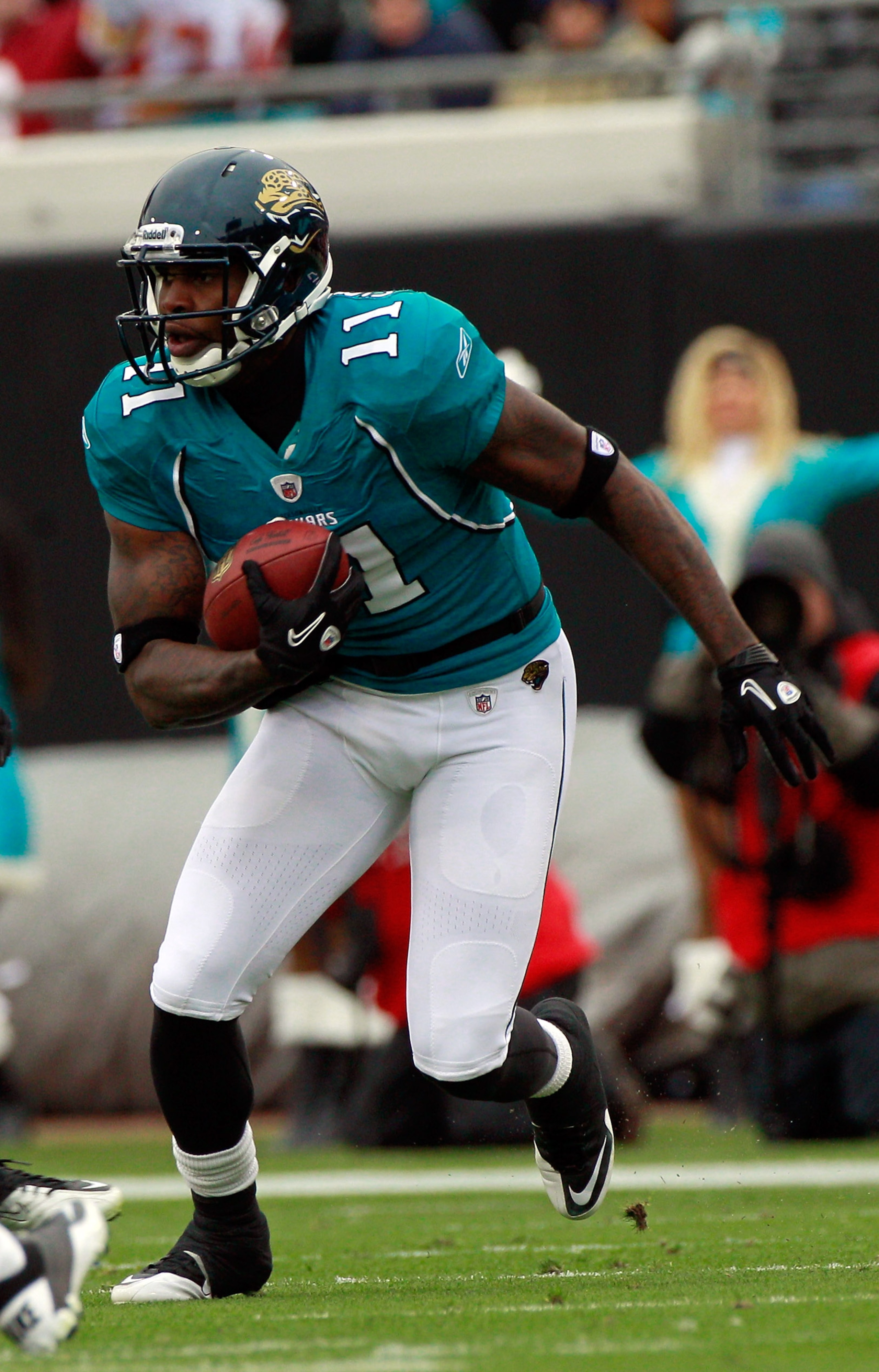 JACKSONVILLE, FL - DECEMBER 26:  Mike Sims-Walker #11 of the Jacksonville Jaguars runs after making a reception during the game against the Washington Redskins at EverBank Field on December 26, 2010 in Jacksonville, Florida.  (Photo by Sam Greenwood/Getty