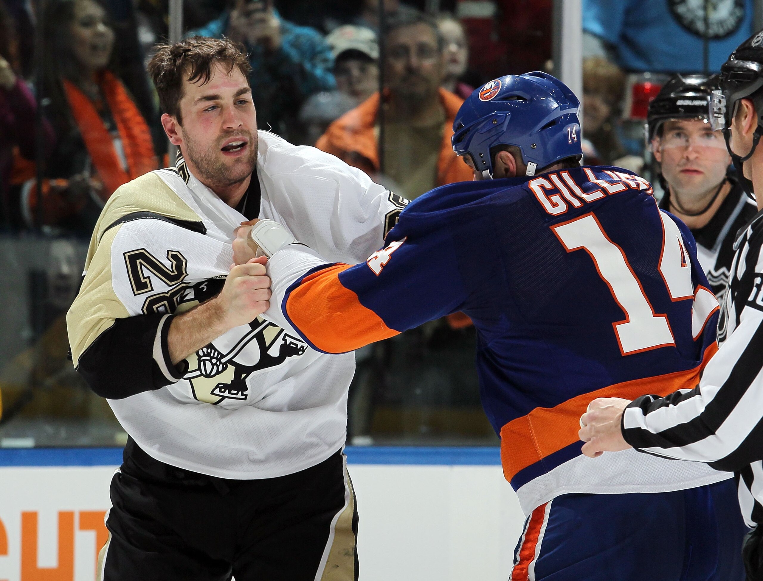 UNIONDALE, NY - FEBRUARY 11:  Trevor Gillies #14 of the New York Islanders fights Eric Godard #28 of the Pittsburgh Penguins on February 11, 2011 at Nassau Coliseum in Uniondale, New York. The Isles defeated the Pens 9-3.  (Photo by Jim McIsaac/Getty Imag