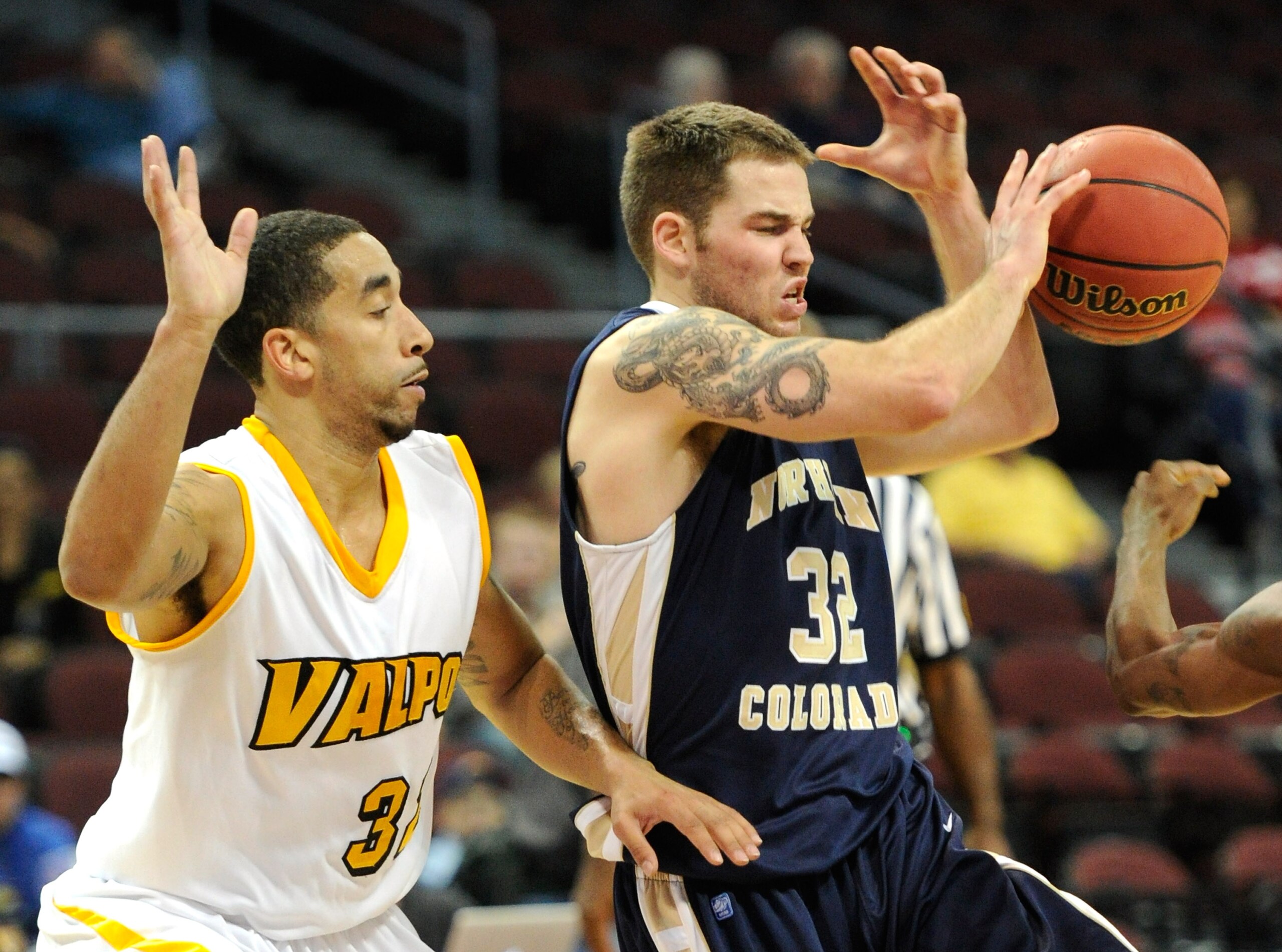 LAS VEGAS - NOVEMBER 26:  Devon Beitzel #32 of the Northern Colorado Bears loses the ball as Brandon Wood #32 of the Valparaiso Crusaders defends during the third round of the Las Vegas Invitational at The Orleans Arena November 26, 2010 in Las Vegas, Nev