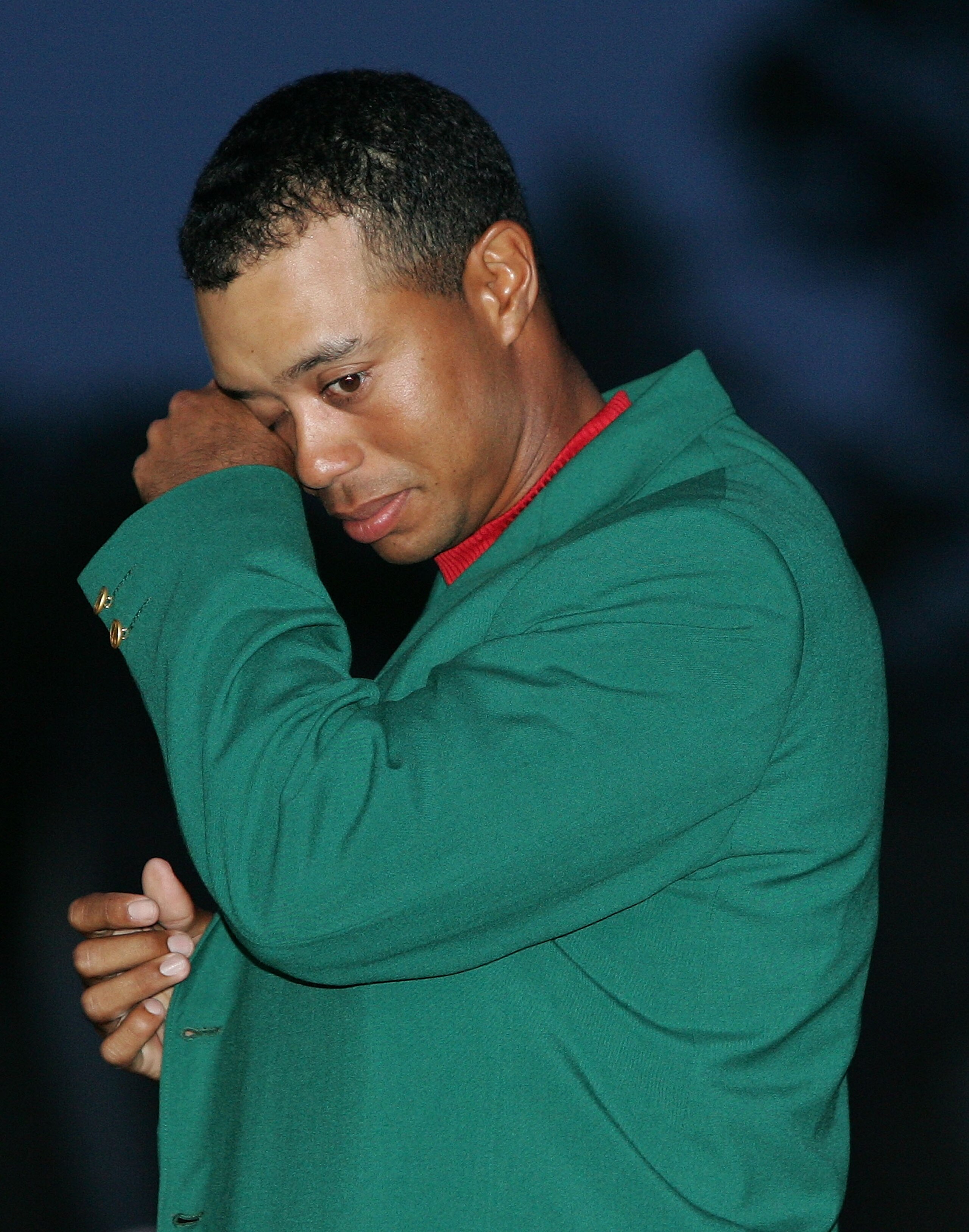 AUGUSTA, GA - APRIL 10:  Tiger Woods wipes a tear back during the green jacket presentation after Woods won The Masters at the Augusta National Golf Club on April 10, 2005 in Augusta, Georgia.  (Photo by Andrew Redington/Getty Images)