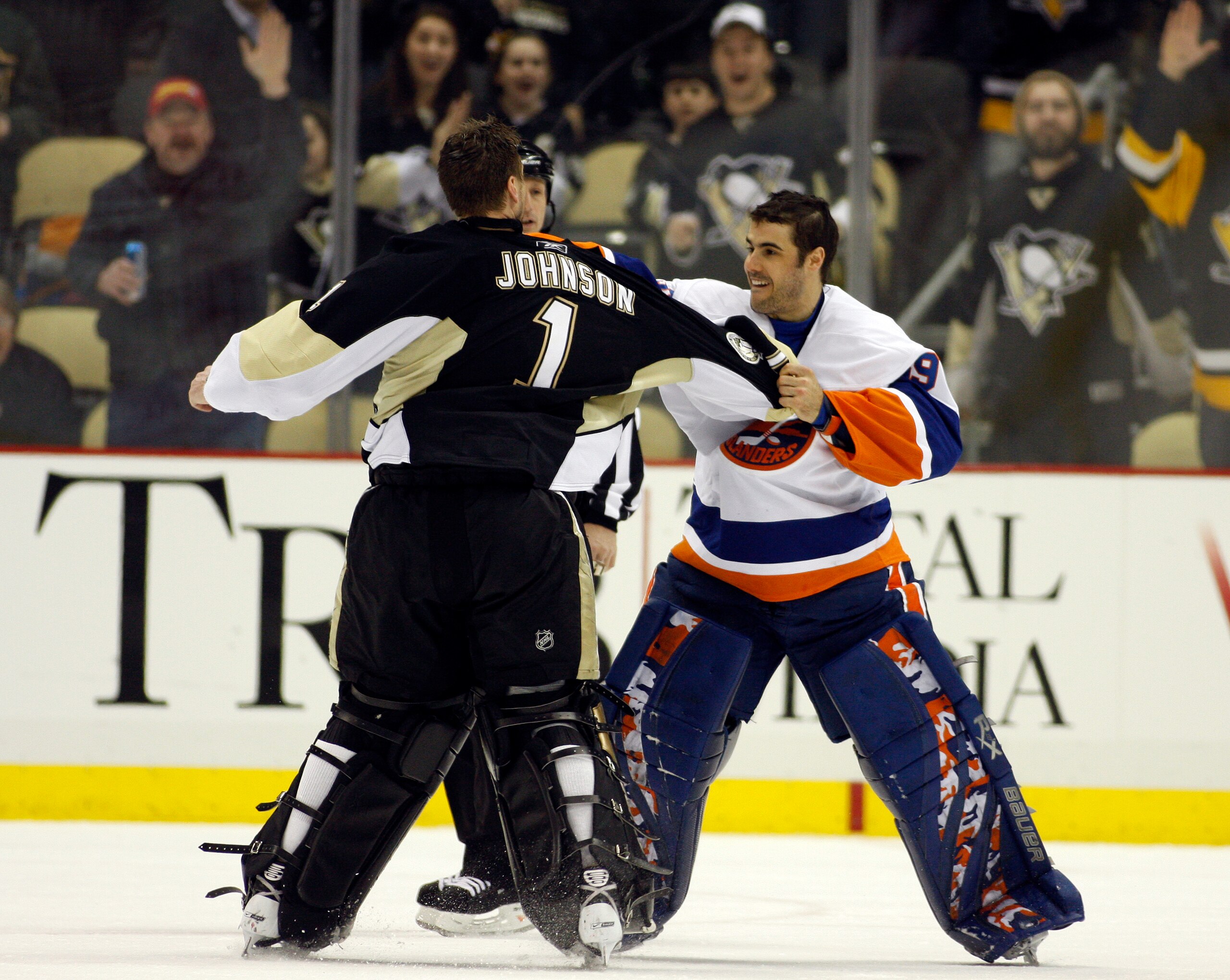 PITTSBURGH, PA - FEBRUARY 02:  Rick DiPietro #39 of the New York Islanders mixes it up against Brent Johnson #1 of the Pittsburgh Penguins at Consol Energy Center on February 2, 2011 in Pittsburgh, Pennsylvania.  The Penguins shut out the Islanders 3-0.