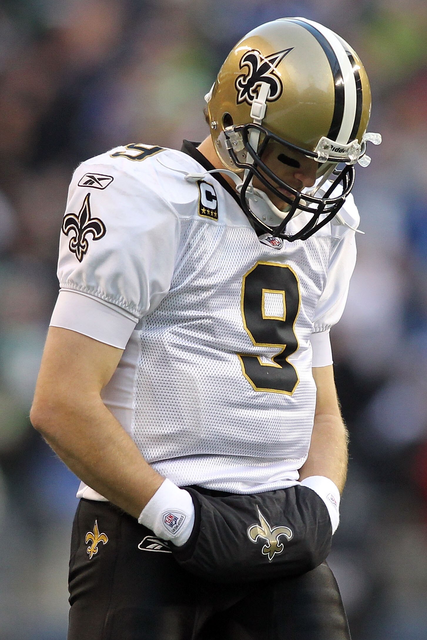 SEATTLE, WA - JANUARY 08:  Quarterback Drew Brees #9 of the New Orleans Saints looks dwon in the second half against the Seattle Seahawks during the 2011 NFC wild-card playoff game at Qwest Field on January 8, 2011 in Seattle, Washington.  (Photo by Jonat