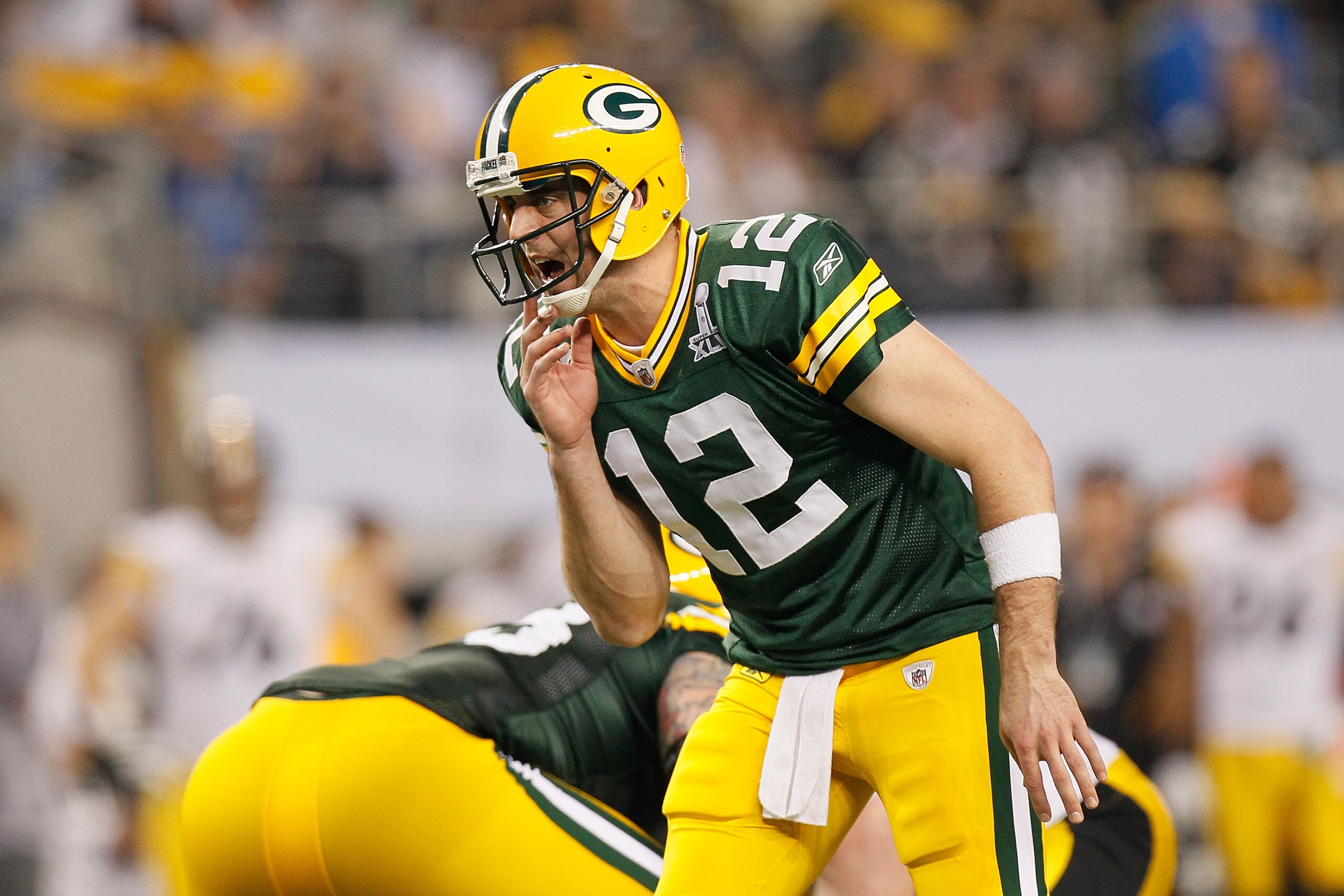 ARLINGTON, TX - FEBRUARY 06: Aaron Rodgers #12 of the Green Bay Packers prepares for the snap against the Pittsburgh Steelers during Super Bowl XLV at Cowboys Stadium on February 6, 2011 in Arlington, Texas.  (Photo by Kevin C. Cox/Getty Images)