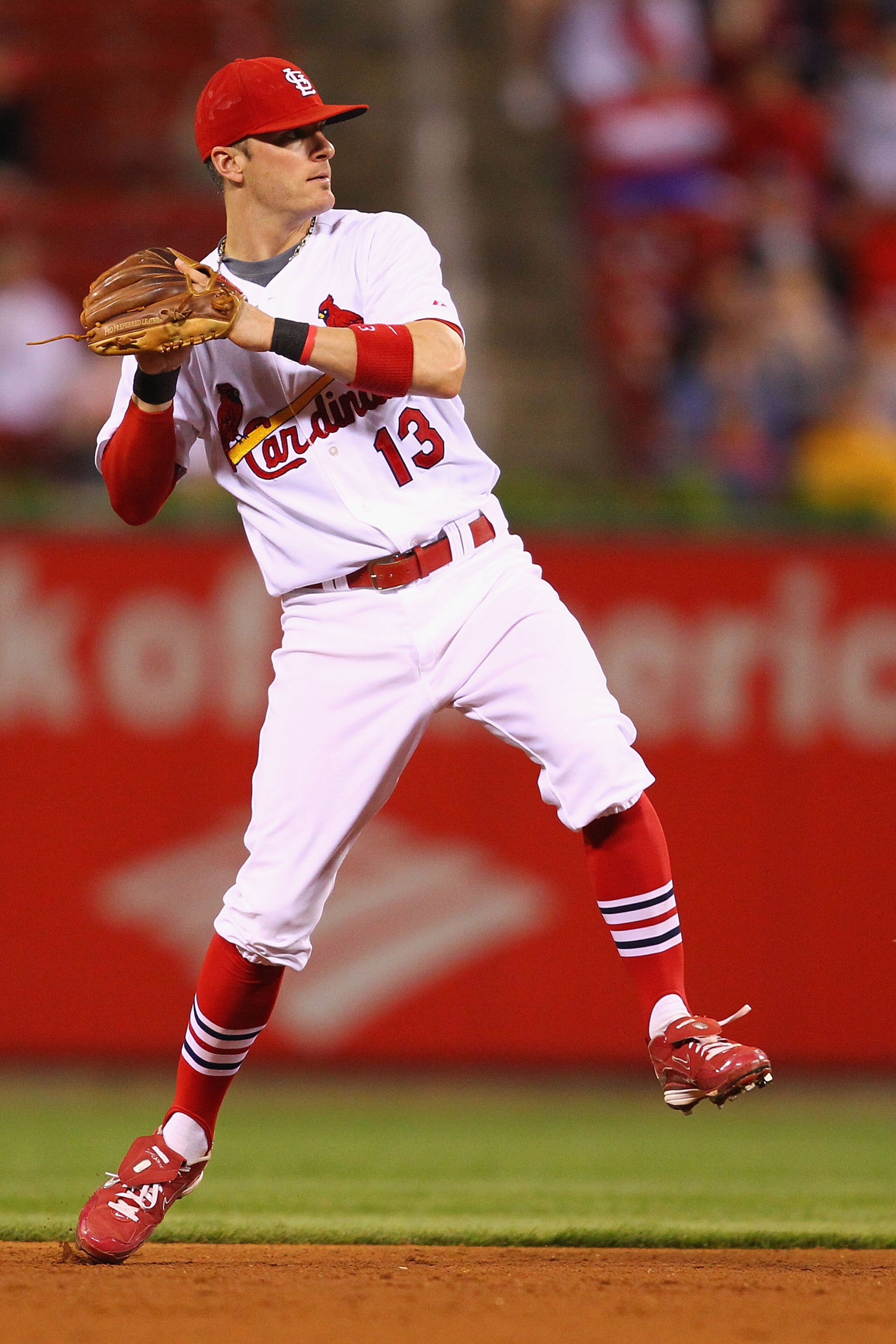 ST. LOUIS - SEPTEMBER 16: Brendan Ryan #13 of the St. Louis Cardinals throws to first base against the San Diego Padres at Busch Stadium on September 16, 2010 in St. Louis, Missouri.  (Photo by Dilip Vishwanat/Getty Images)