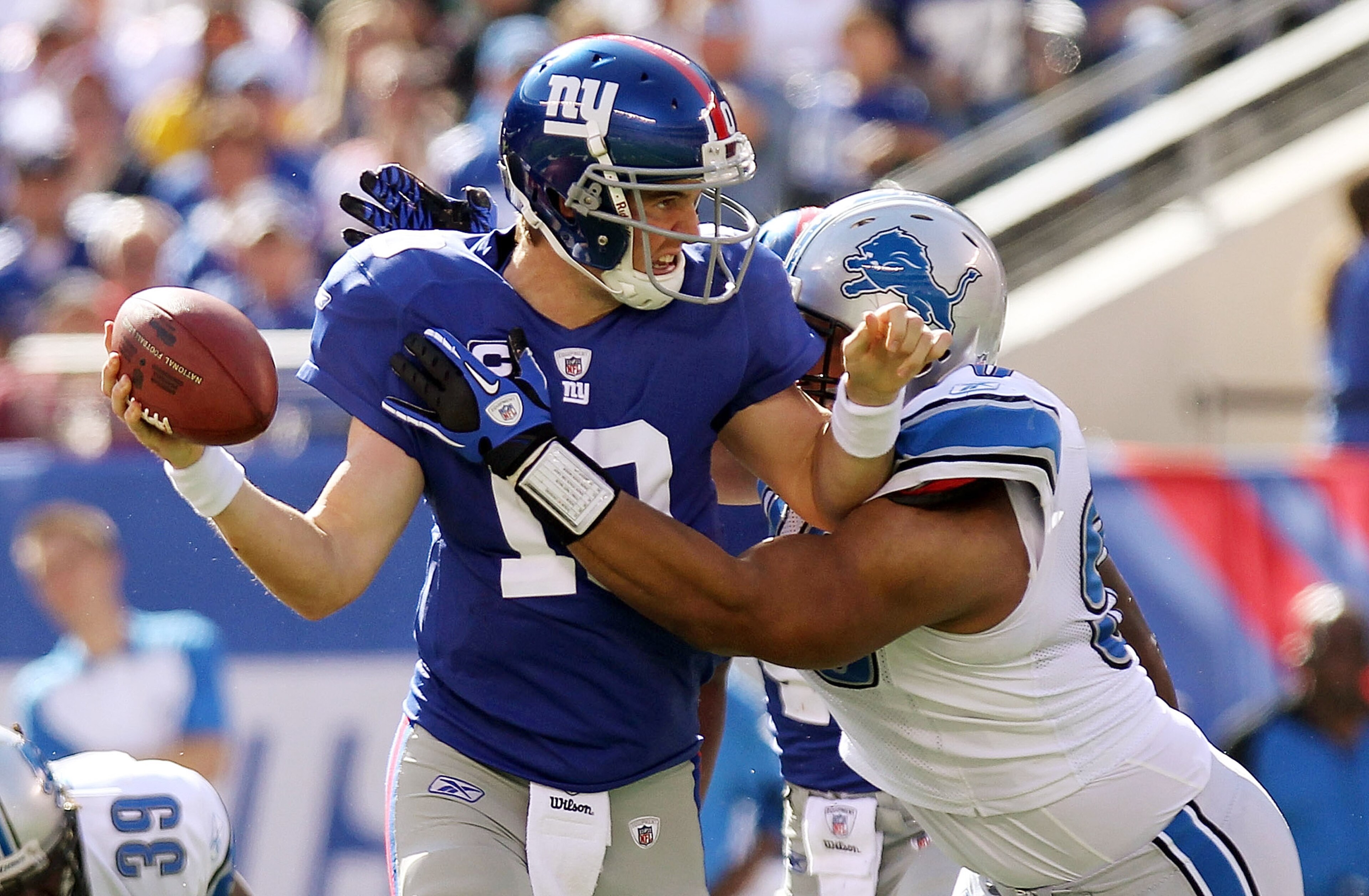 EAST RUTHERFORD, NJ - OCTOBER 17: Eli Manning #10 of the New York Giants is sacked by Ndamukong Suh #90 of the Detroit Lions at New Meadowlands Stadium on October 17, 2010 in East Rutherford, New Jersey. (Photo by Nick Laham/Getty Images) EAST RUTHERFORD, NJ - OCTOBER 17: Eli Manning #10 of the New York Giants is sacked by Ndamukong Suh #90 of the Detroit Lions at New Meadowlands Stadium on October 17, 2010 in East Rutherford, New Jersey. (Photo by Nick Laham/Getty Images)
