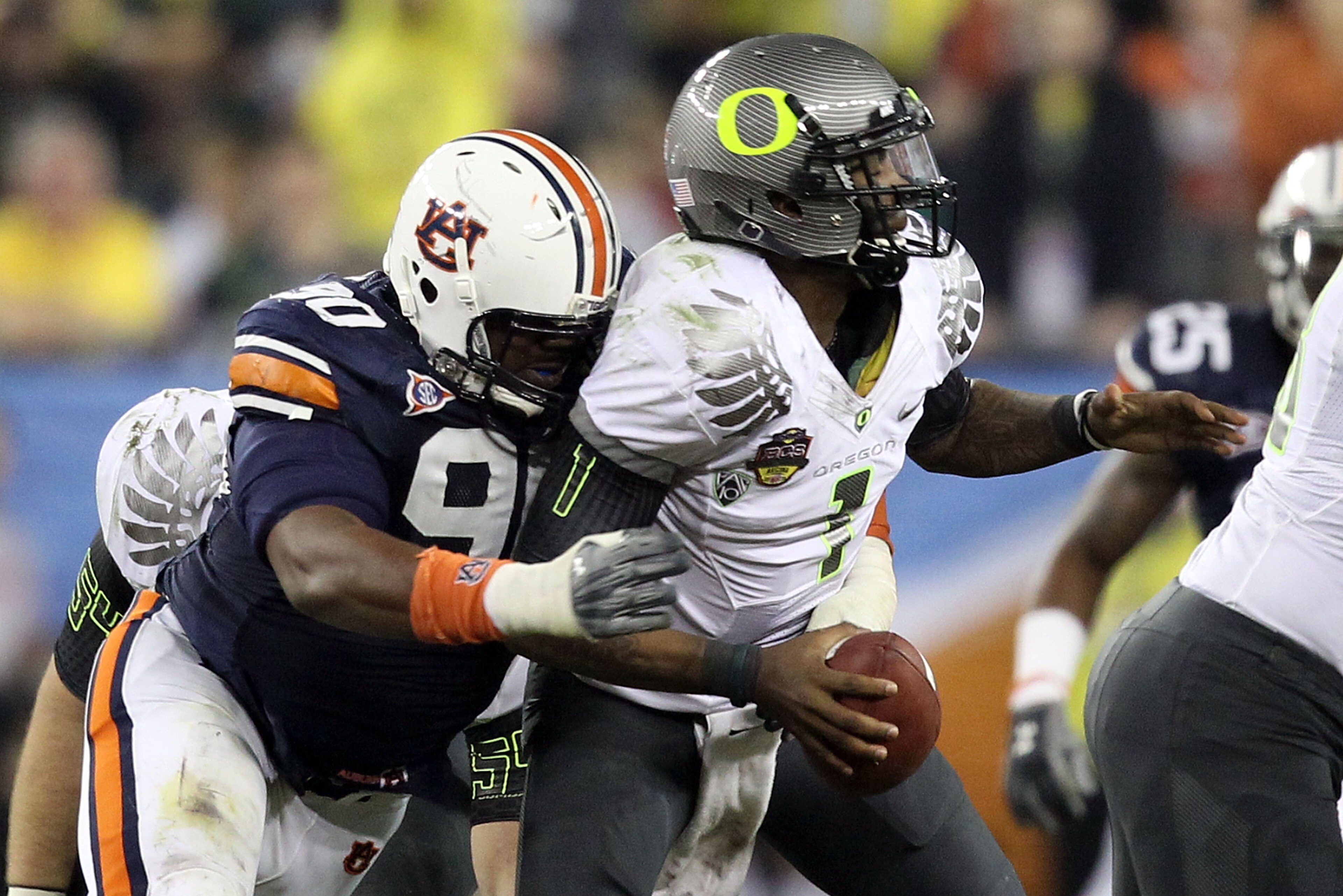 GLENDALE, AZ - JANUARY 10: Nick Fairley #90 of the Auburn Tigers sacks Darron Thomas #1 of the Oregon Ducks in the fourth quarter of the Tostitos BCS National Championship Game at University of Phoenix Stadium on January 10, 2011 in Glendale, Arizona. (Ph GLENDALE, AZ - JANUARY 10: Nick Fairley #90 of the Auburn Tigers sacks Darron Thomas #1 of the Oregon Ducks in the fourth quarter of the Tostitos BCS National Championship Game at University of Phoenix Stadium on January 10, 2011 in Glendale, Arizona. (Ph