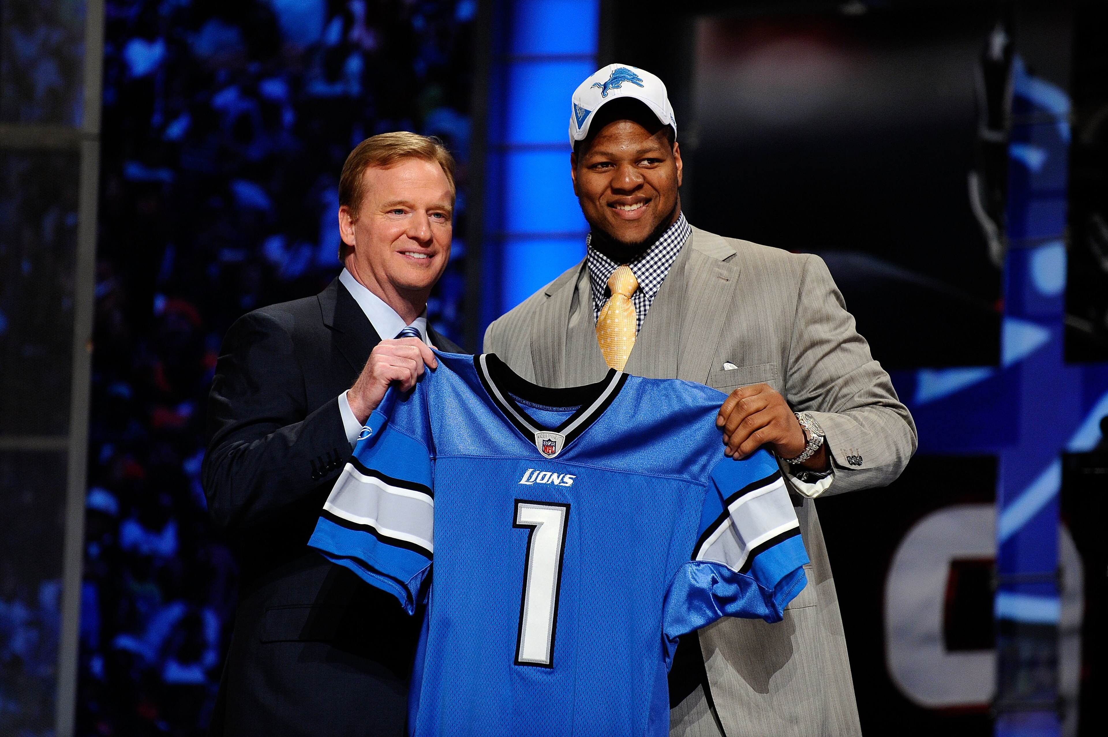 NEW YORK - APRIL 22: Ndamukong Suh (R) from the Nebraska Cornhuskers poses with NFL Commissioner Roger Goodell as they hold up a Detroit Lions jersey after Suh was selected by the Lions number 2 overall during the first round of the 2010 NFL Draft at Rad NEW YORK - APRIL 22: Ndamukong Suh (R) from the Nebraska Cornhuskers poses with NFL Commissioner Roger Goodell as they hold up a Detroit Lions jersey after Suh was selected by the Lions number 2 overall during the first round of the 2010 NFL Draft at Rad