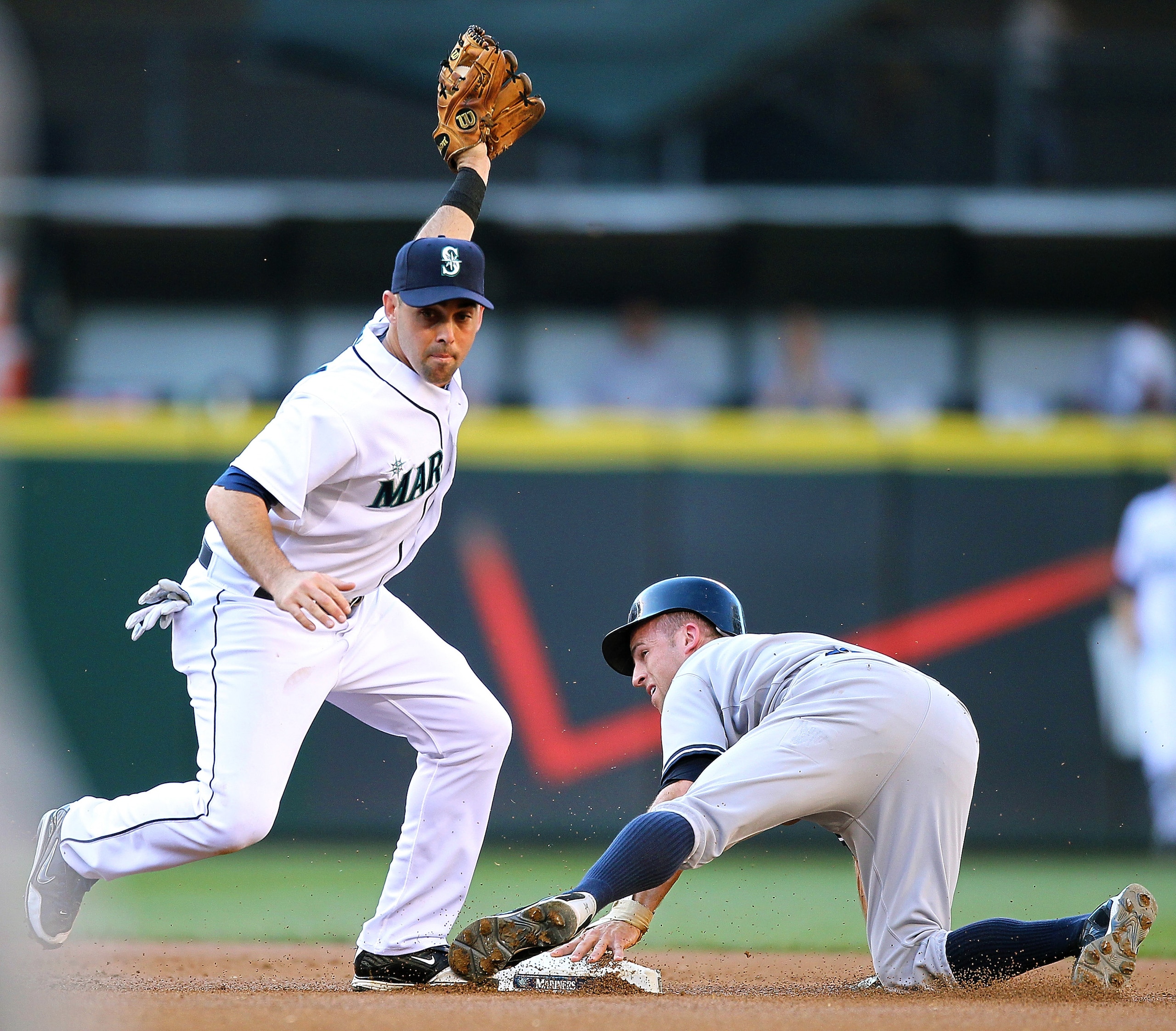 SEATTLE - JULY 10:  Brett Gardner #11 of the New York Yankees is tagged out at second base on a steal attempt by Jack Wilson #2 of the Seattle Mariners at Safeco Field on July 10, 2010 in Seattle, Washington. (Photo by Otto Greule Jr/Getty Images)