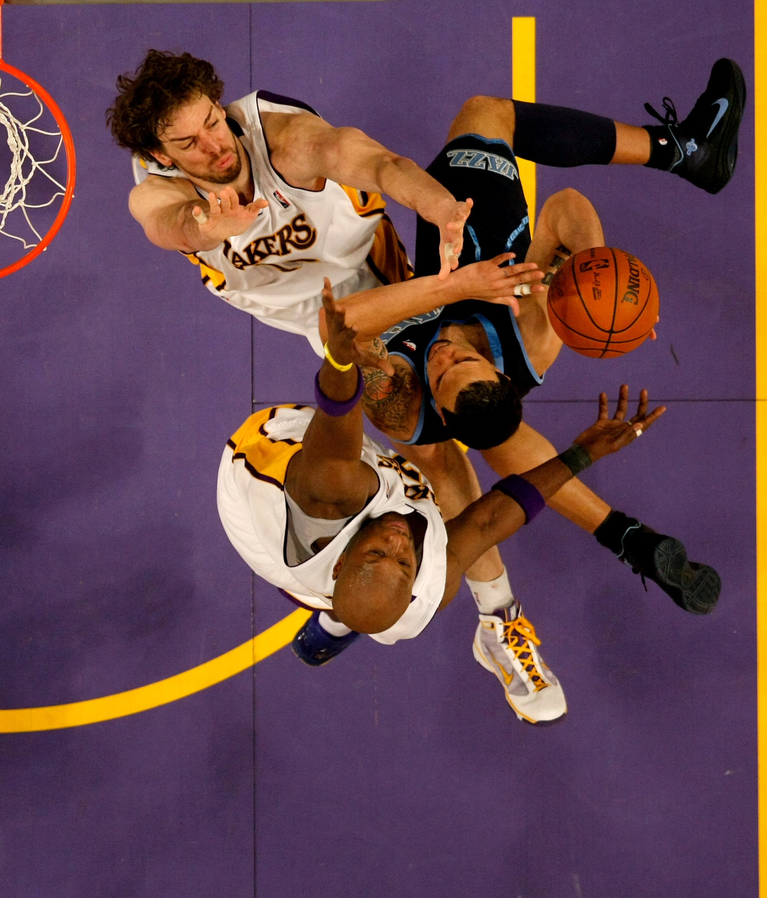 LOS ANGELES - MAY 2:   Deron Williams #8 of the Utah Jazz goes up for a shot against Pau Gasol #16 and Lamar Odom #7 of the Los Angeles Lakers during Game One of the Western Conference Semifinals of the 2010 NBA Playoffs on May 2, 2010 at Staples Center i