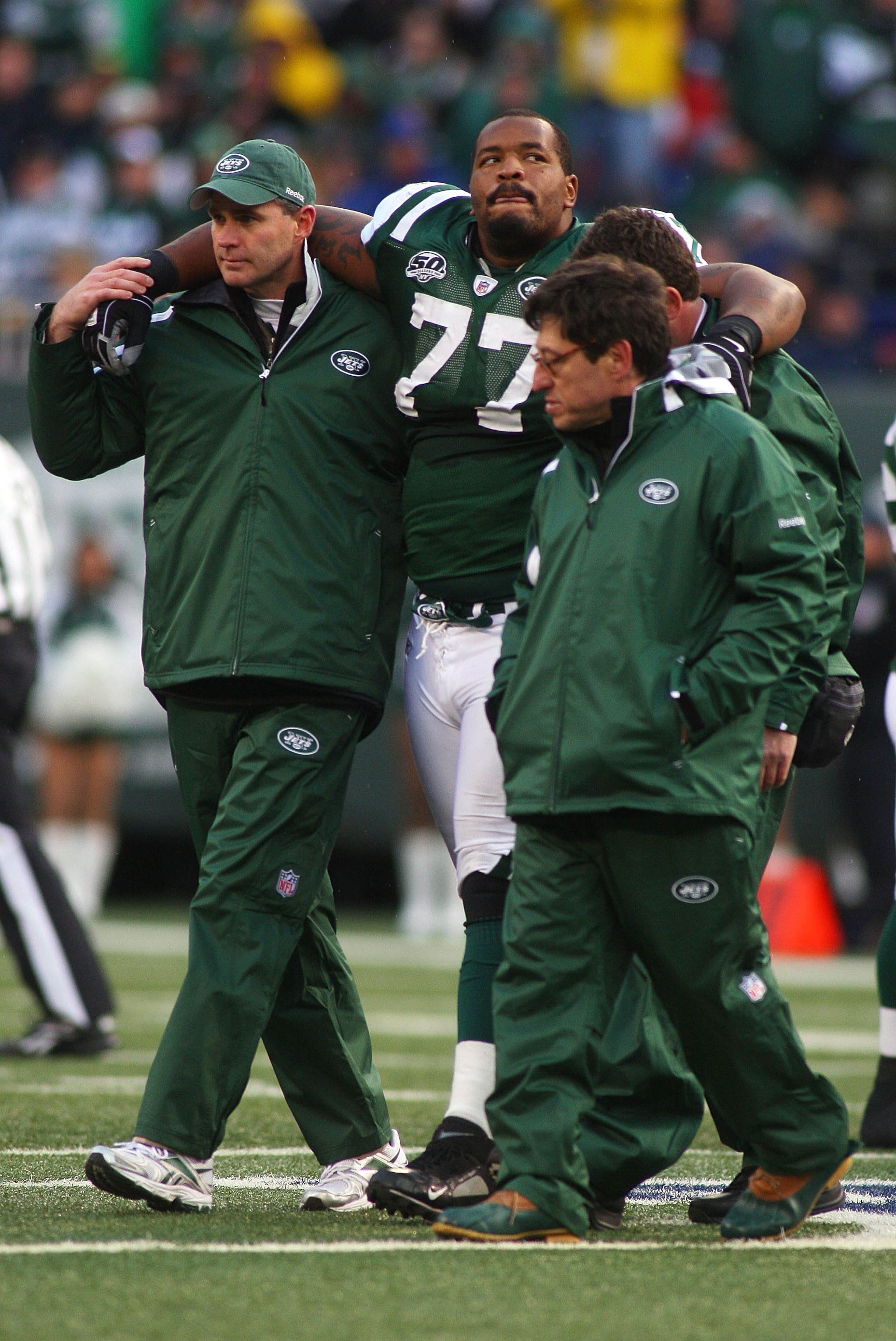 EAST RUTHERFORD, NJ - OCTOBER 18: Kris Jenkins #77 of the New York Jets is helped off the field after being injured in the second quarter against the Buffalo Bills at Giants Stadium in the Meadowlands on October 18, 2009 in East Rutherford, New Jersey. EAST RUTHERFORD, NJ - OCTOBER 18: Kris Jenkins #77 of the New York Jets is helped off the field after being injured in the second quarter against the Buffalo Bills at Giants Stadium in the Meadowlands on October 18, 2009 in East Rutherford, New Jersey.