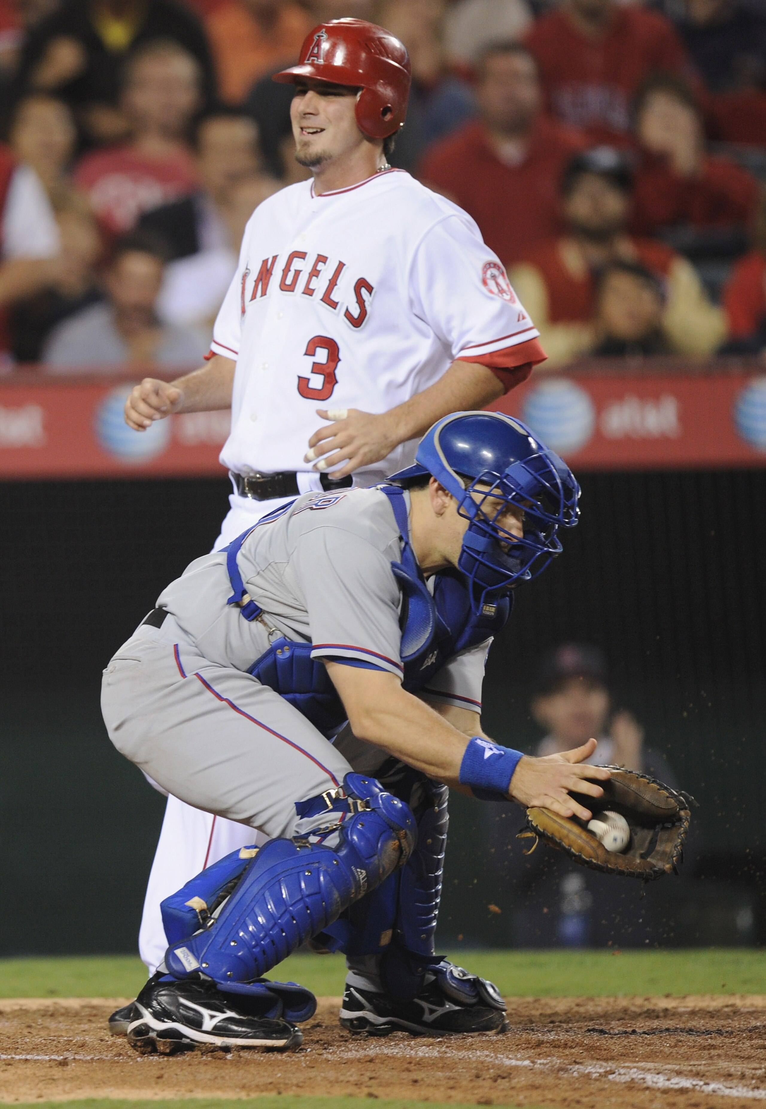 ANAHEIM, CA - SEPTEMBER 20:  Brandon Wood #3 of the Los Angeles Angels of Anaheim reacts as he scores a run off of a Jeff Mathis #5 double in front of Matt Treanor #20 for a 2-1 lead during the fourth inning at Angel Stadium on September 20, 2010 in Anahe