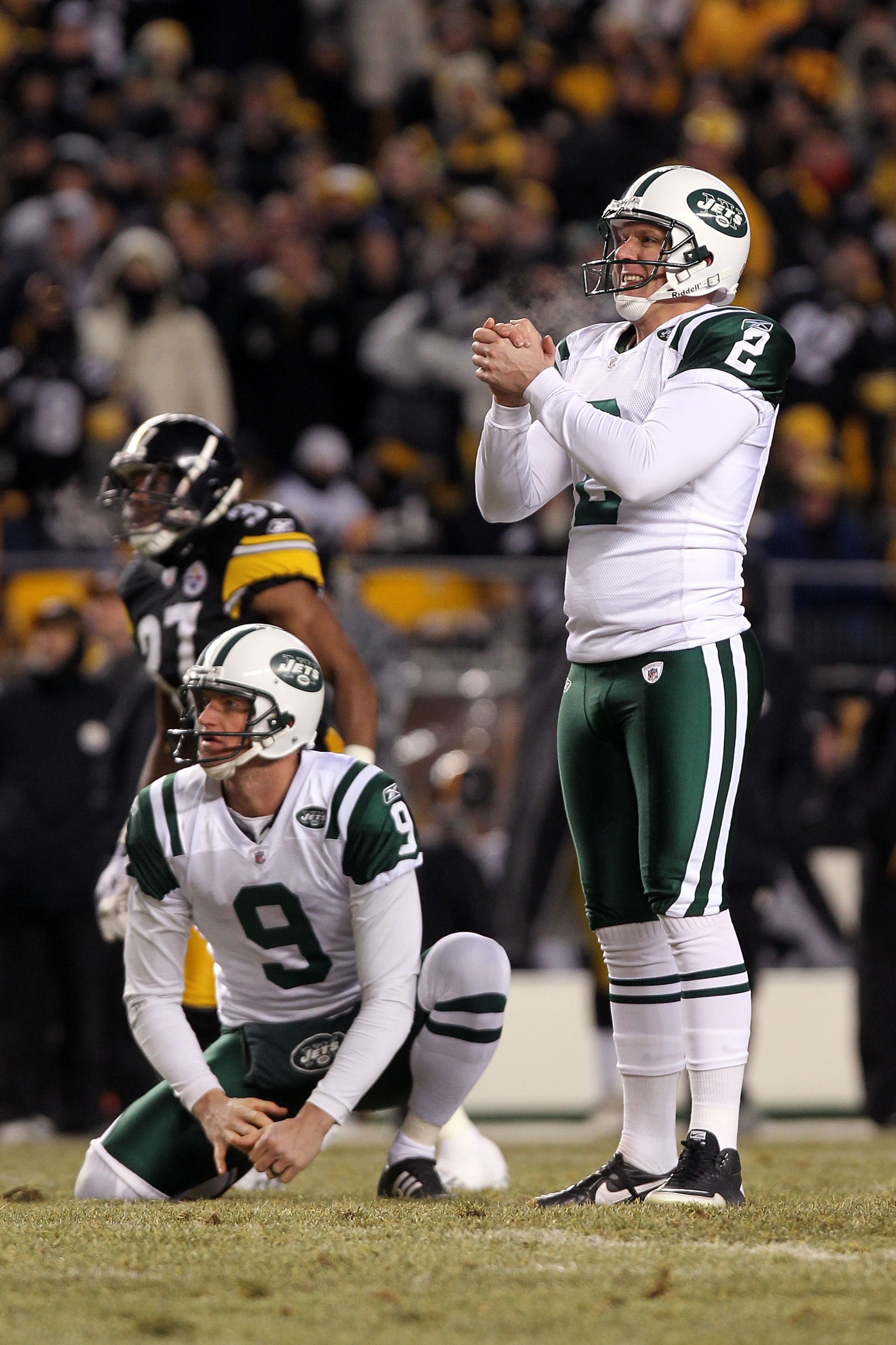 PITTSBURGH, PA - JANUARY 23: Nick Folk #2 and Steve Weatherford #9 of the New York Jets react to their second quarter field goal against the Pittsburgh Steelers during the 2011 AFC Championship game at Heinz Field on January 23, 2011 in Pittsburgh, Penns PITTSBURGH, PA - JANUARY 23: Nick Folk #2 and Steve Weatherford #9 of the New York Jets react to their second quarter field goal against the Pittsburgh Steelers during the 2011 AFC Championship game at Heinz Field on January 23, 2011 in Pittsburgh, Penns