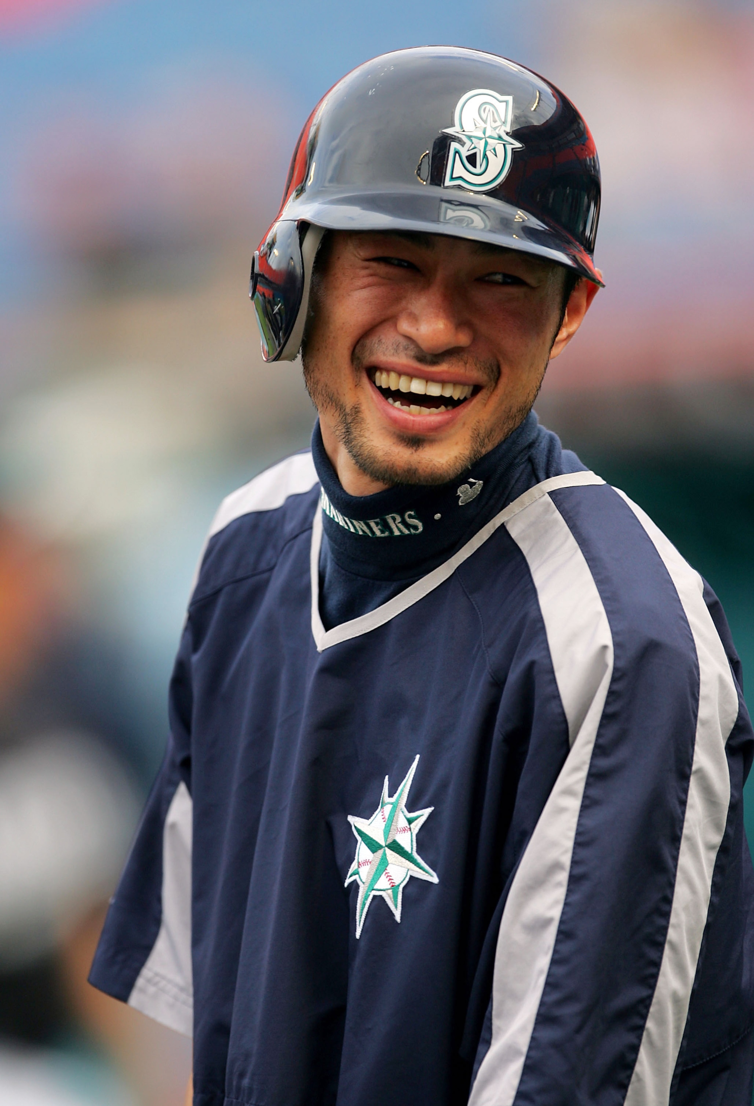 MIAMI - JUNE 8:  Ichiro Suzuki #51 of the Seattle Mariners laughs at a joke during batting practice prior to the game between the Seattle Mariners and the Florida Marlins on June 8, 2005 at Dolphin Stadium in Miami, Florida.  (Photo By Jamie Squire/Getty