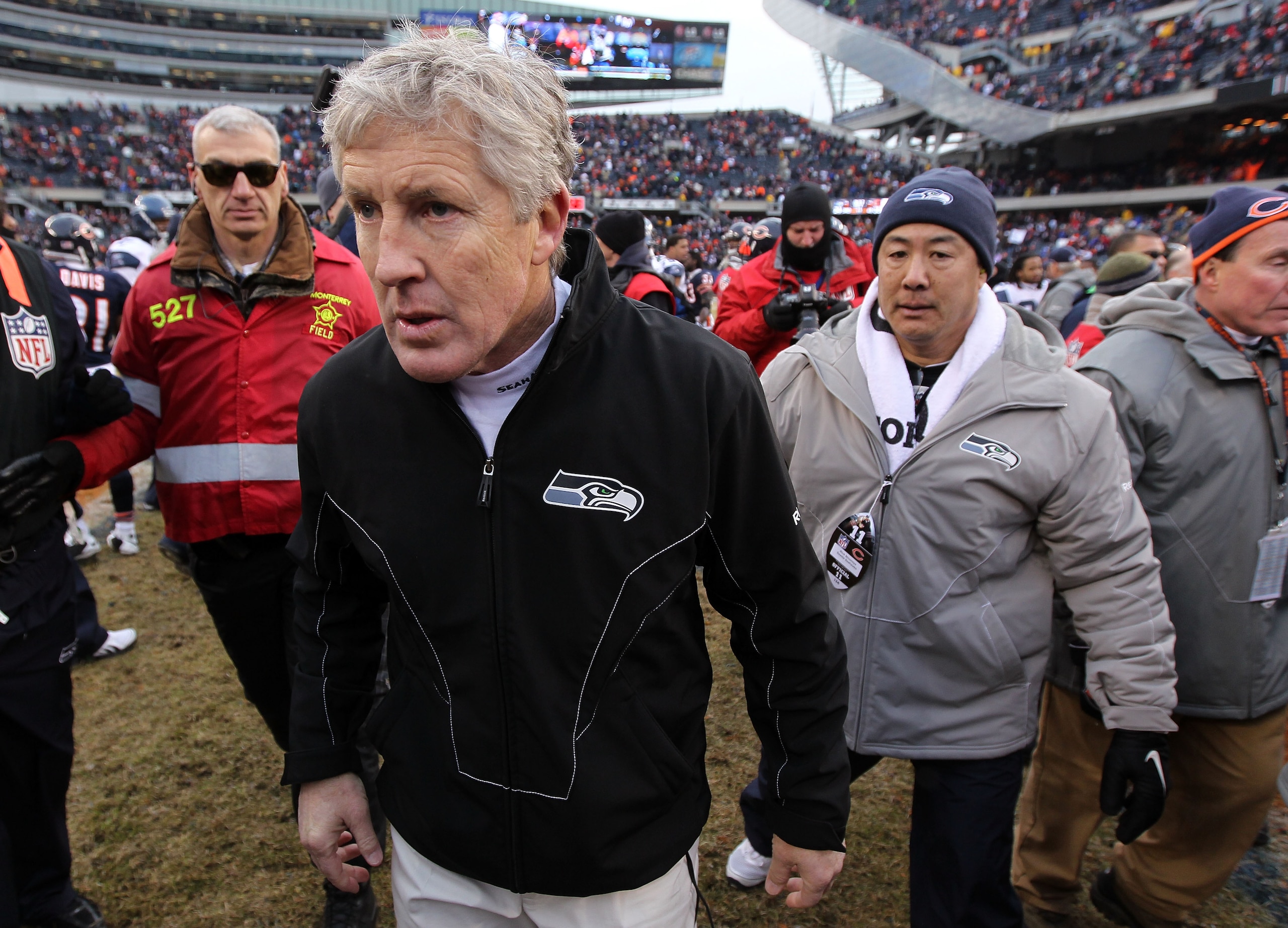 CHICAGO, IL - JANUARY 16:  Head coach Pete Carroll of the Seattle Seahawks runs off the field after the Seahawks 35-24 defeat to the Chicago Bears in the 2011 NFC divisional playoff game at Soldier Field on January 16, 2011 in Chicago, Illinois.  (Photo b