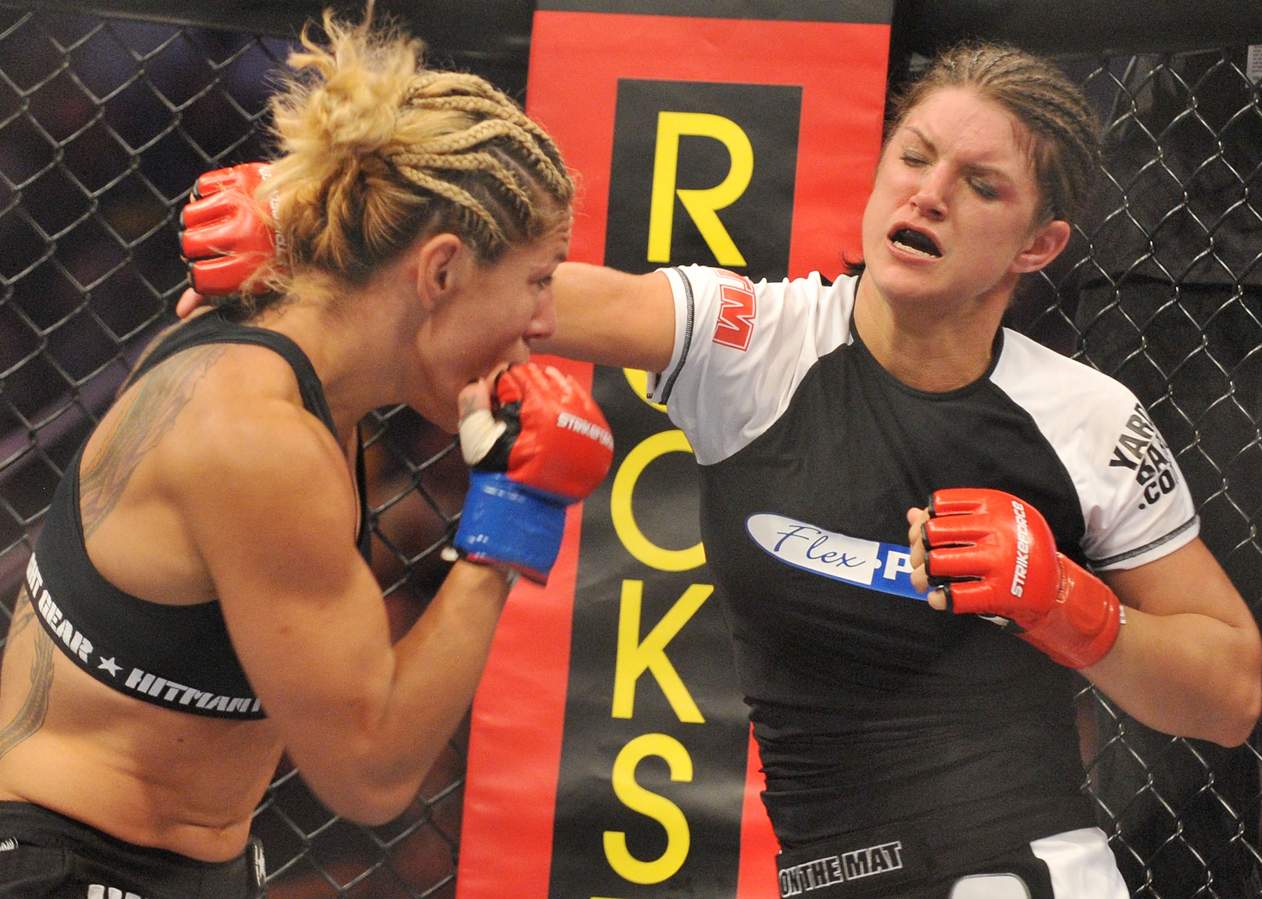 SAN JOSE, CA - AUGUST 15:  Cris Cyborg (L) battles Gina Carano during their Middleweight Championship fight at Stikeforce: Carano vs. Cyborg on August 15, 2009 in San Jose, California.  (Photo by Jon Kopaloff/Getty Images)