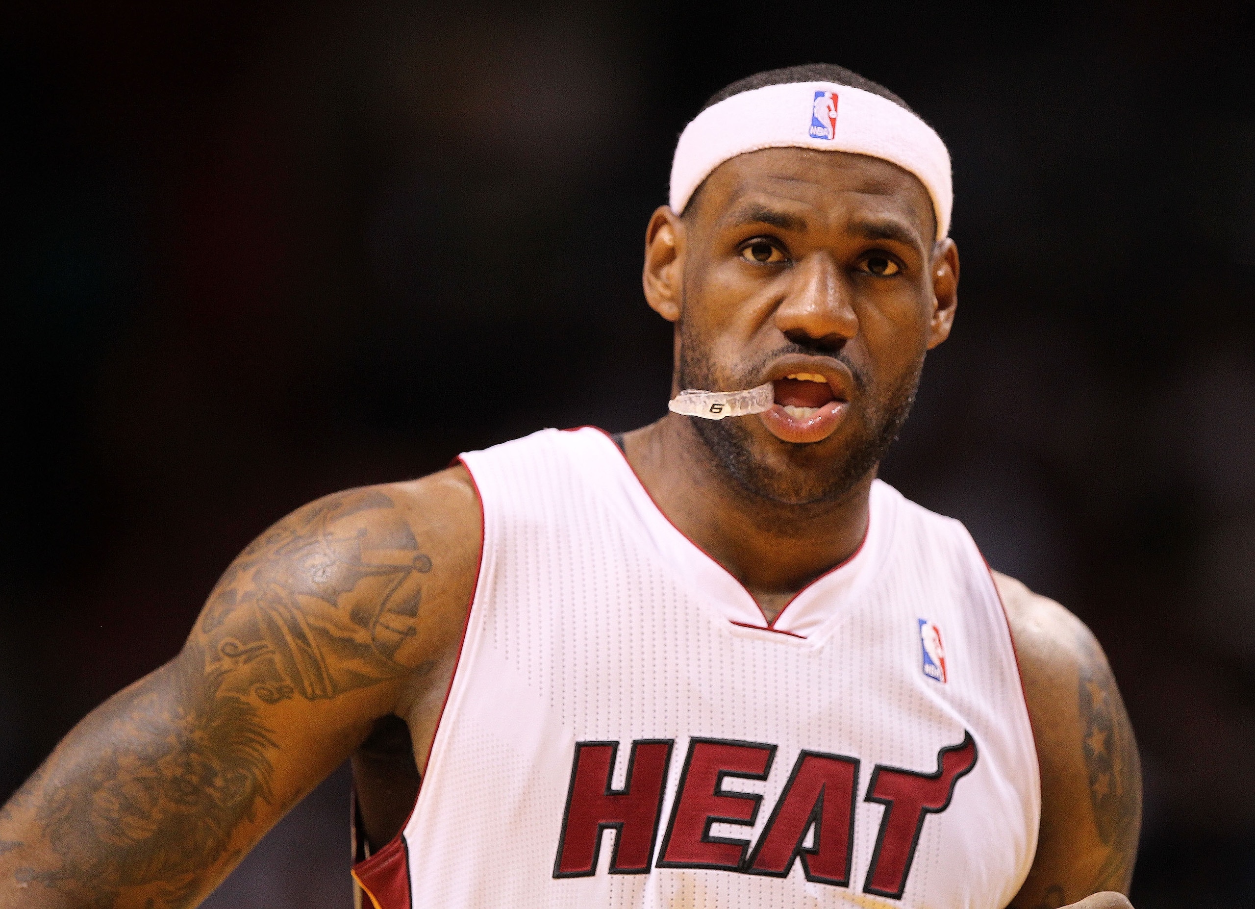 MIAMI, FL - JANUARY 31:  LeBron James #6 of the Miami Heat looks on during a game against the Cleveland Cavaliers at American Airlines Arena on January 31, 2011 in Miami, Florida. NOTE TO USER: User expressly acknowledges and agrees that, by downloading a