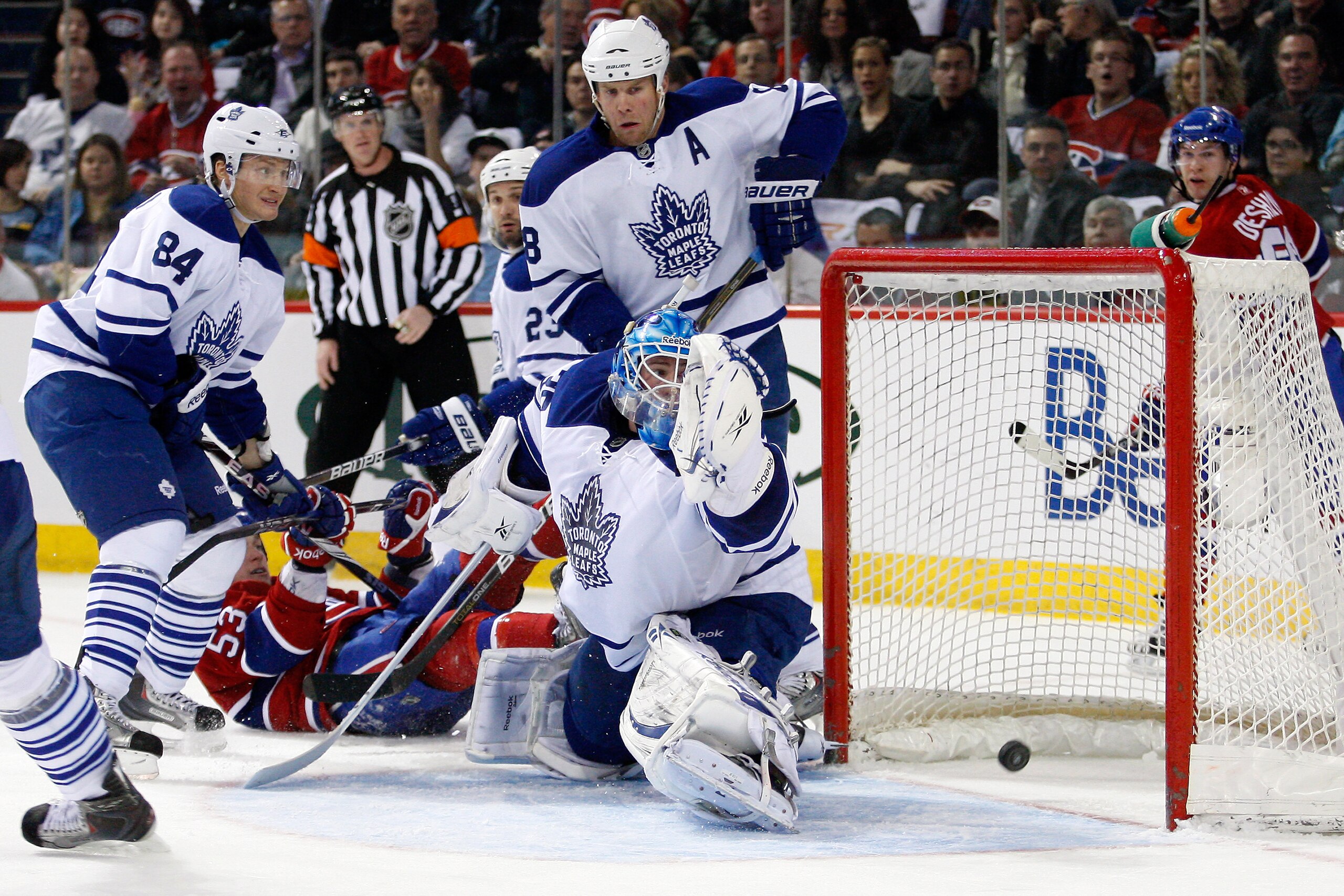 MONTREAL, CANADA - FEBRUARY 12:  Jean-Sebastien Giguere #35 of the Toronto Maple Leafs lets in a goal on a shot by Benoit Pouliot #57 of the Montreal Canadiens (not pictured) during the NHL game at the Bell Centre on February 12, 2011 in Montreal, Quebec,