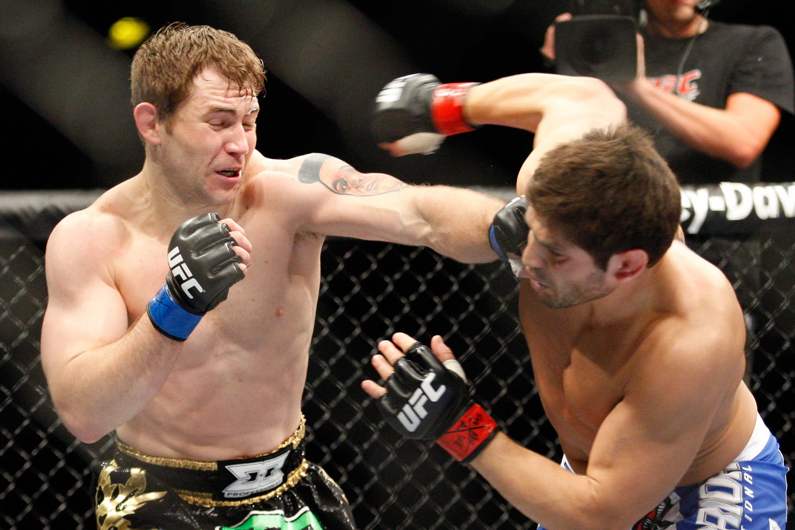 MONTREAL- MAY 8: Alan Belcher (L) punches Patrick Cote in their middleweight bout at UFC 113 at Bell Centre on May 8, 2010 in Montreal, Quebec, Canada.  (Photo by Richard Wolowicz/Getty Images)