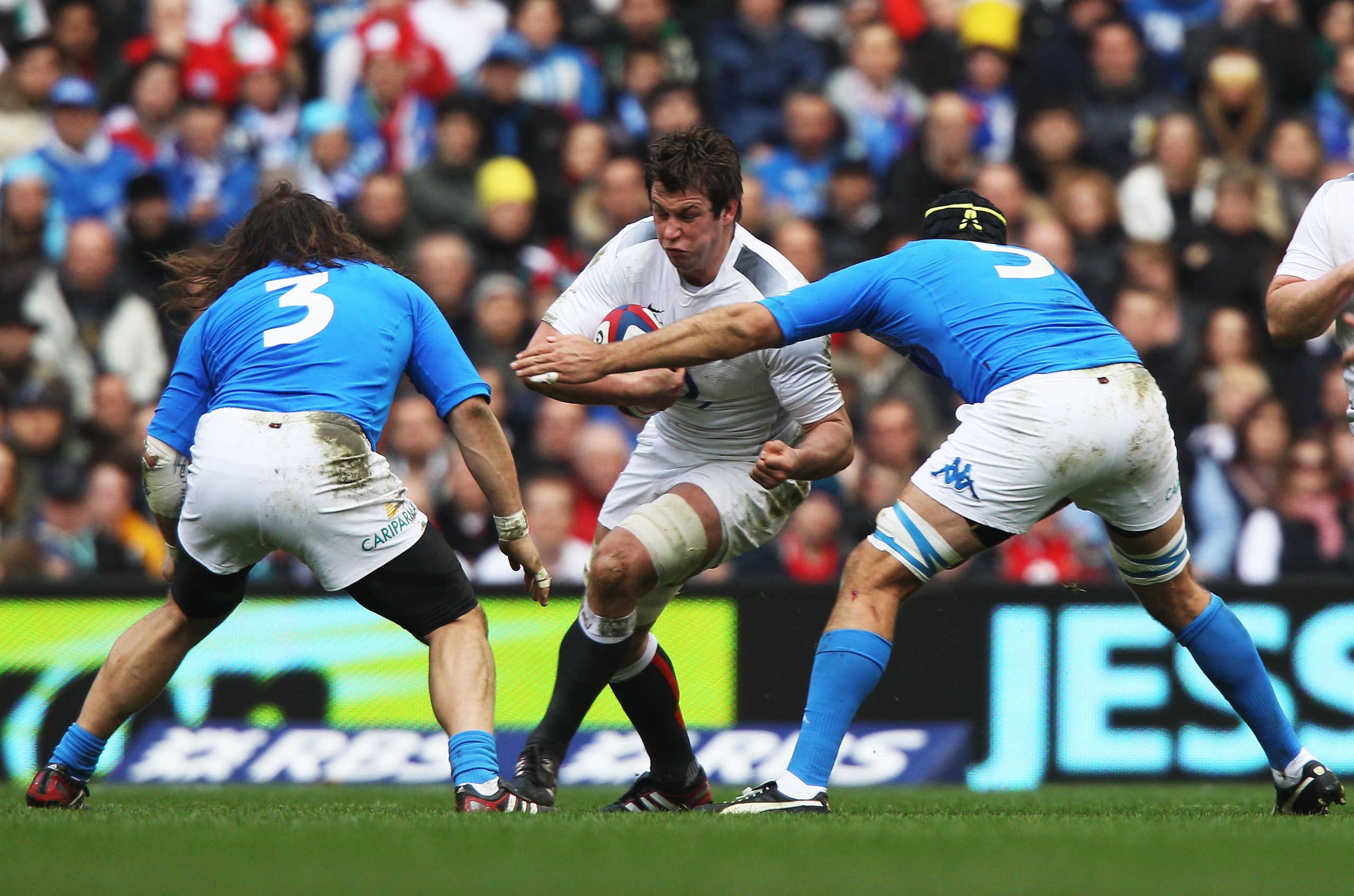 LONDON, ENGLAND - FEBRUARY 12:  Louis Deacon of England is tackled by Martin Castrogiovanni (L) and Quintin Geldenhuys (R) of Italy during the RBS 6 Nations Championship match between England and Italy at Twickenham Stadium on February 12, 2011 in London,