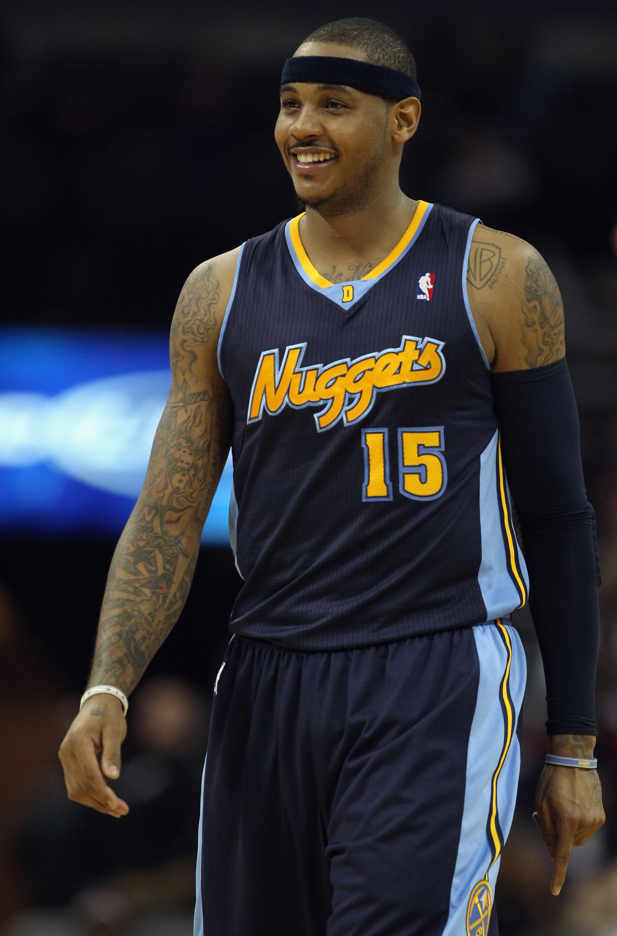 CHARLOTTE, NC - DECEMBER 07: Carmelo Anthony #15 of the Denver Nuggets watches on against the Charlotte Bobcats during their game at Time Warner Cable Arena on December 7, 2010 in Charlotte, North Carolina. NOTE TO USER: User expressly acknowledges and CHARLOTTE, NC - DECEMBER 07: Carmelo Anthony #15 of the Denver Nuggets watches on against the Charlotte Bobcats during their game at Time Warner Cable Arena on December 7, 2010 in Charlotte, North Carolina. NOTE TO USER: User expressly acknowledges and