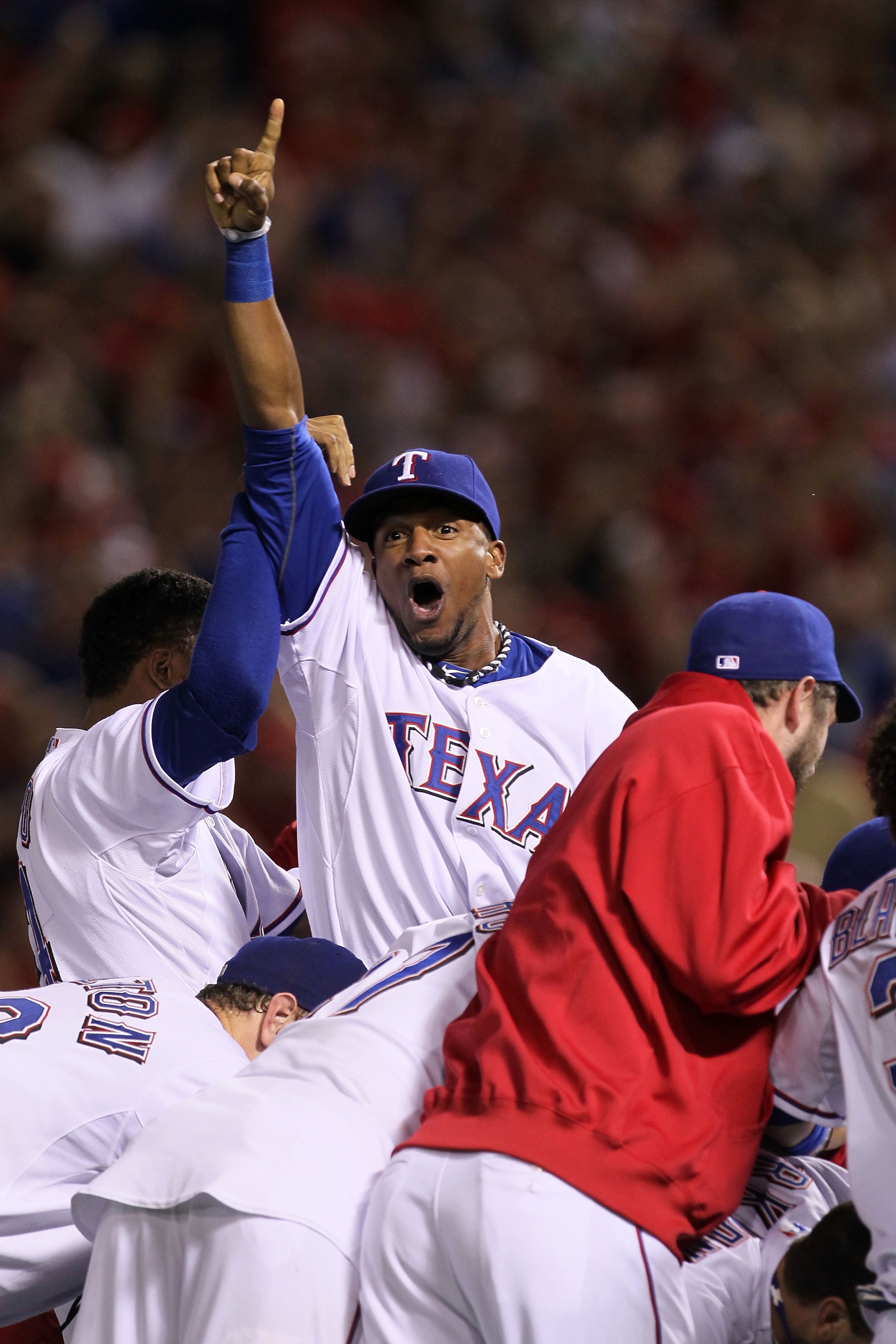 ARLINGTON, TX - OCTOBER 22:  Julio Borbon #29 of the Texas Rangers celebrates on the field after defeating the New York Yankees 6-1 in Game Six of the ALCS to advance to the World Series during the 2010 MLB Playoffs at Rangers Ballpark in Arlington on Oct