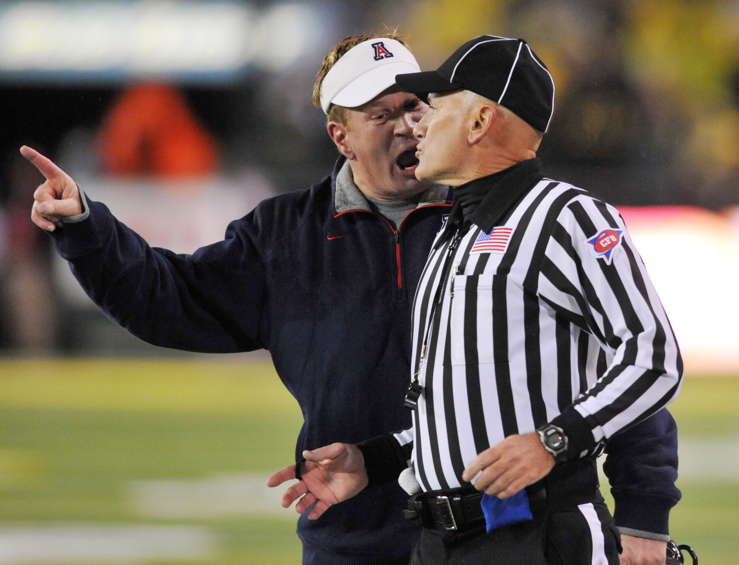 EUGENE, OR - NOVEMBER 26: Head coach Mike Stoops of the Arizona Wildcats has some words with an official in the second quarter of the game against the the Oregon Ducks at Autzen Stadium on November 26, 2010 in Eugene, Oregon. (Photo by Steve Dykes/Getty I