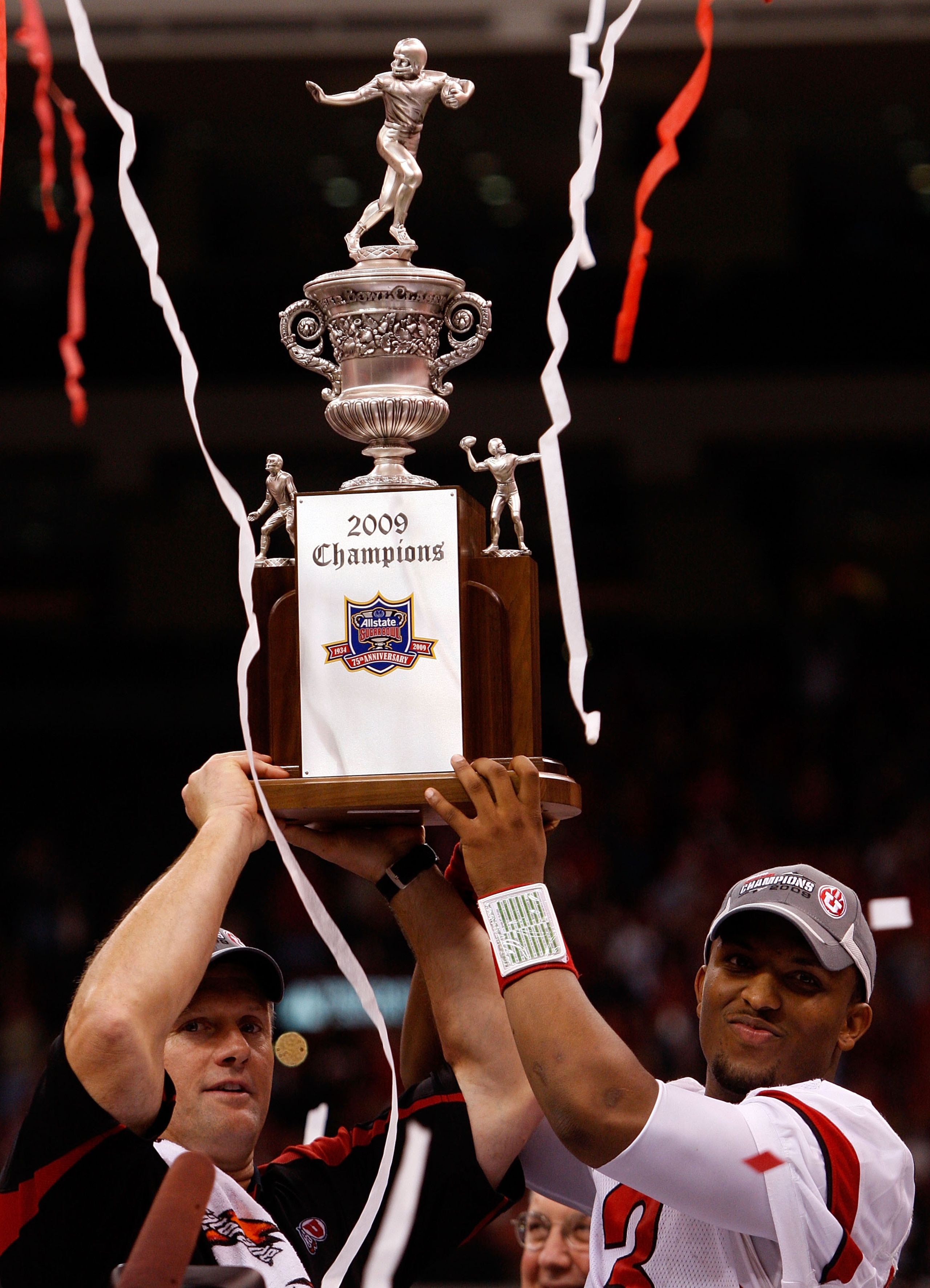 NEW ORLEANS - JANUARY 02:  Head coach Kyle Whittingham and quarterback Brian Johnson #3 of the Utah Utes celebrates after defeating the Alabama Crimson Tide 31-17 during the 75th Allstate Sugar Bowl at the Louisiana Superdome on January 2, 2009 in New Orl