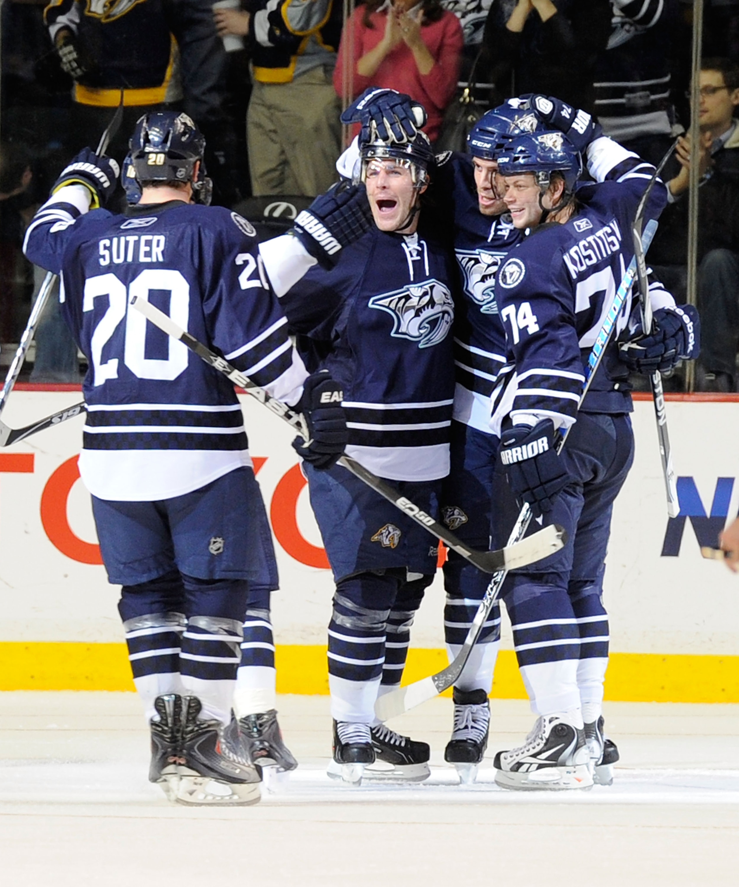 NASHVILLE, TN - FEBRUARY 12:   Ryan Suter #20, Mike Fisher #12, Shea Weber #6, and Sergei Kostitsyn #74 of the Nashville Predators celebrate after a goal against the Colorado Avalanche on February 12, 2011 at the Bridgestone Arena in Nashville, Tennessee.